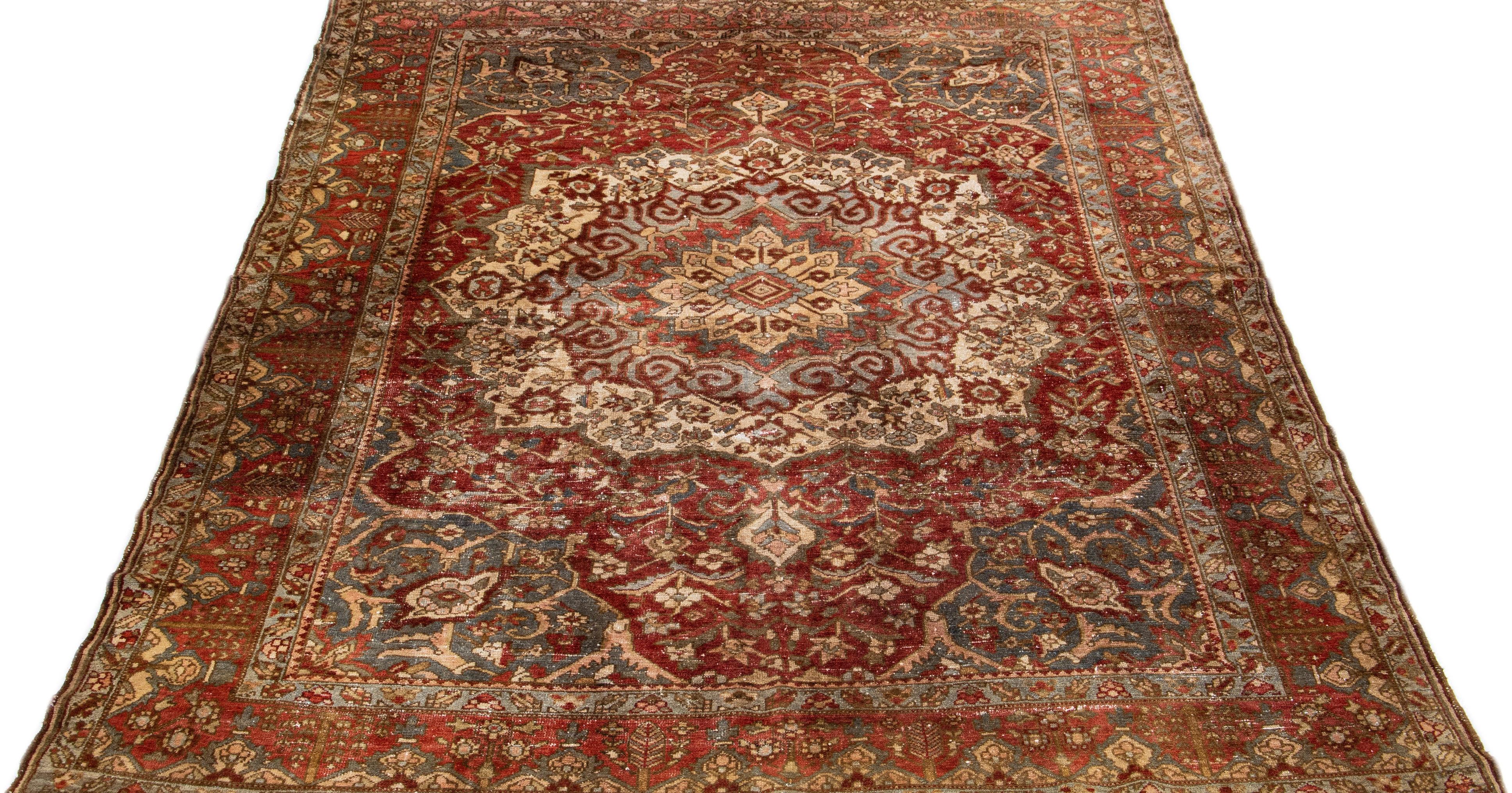 This Bakhtiari hand knotted wool rug features a rust field and multicolor accents on a Classic rosette design, crafted with the utmost care and detail.

This rug measures 9'10