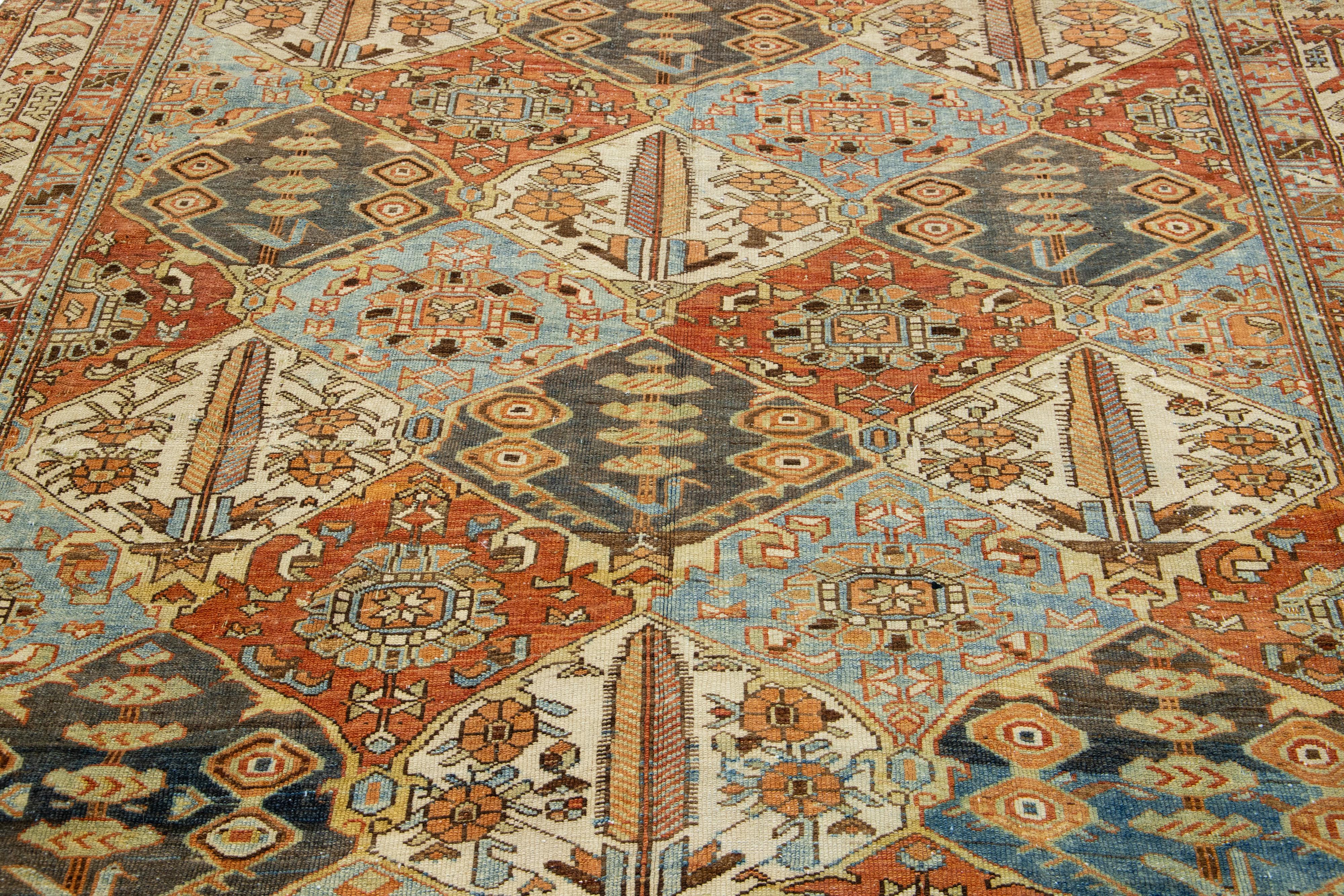 20th Century Antique Persian Bakhtiari Handmade Wool Rug With Allover Multicolor Design For Sale