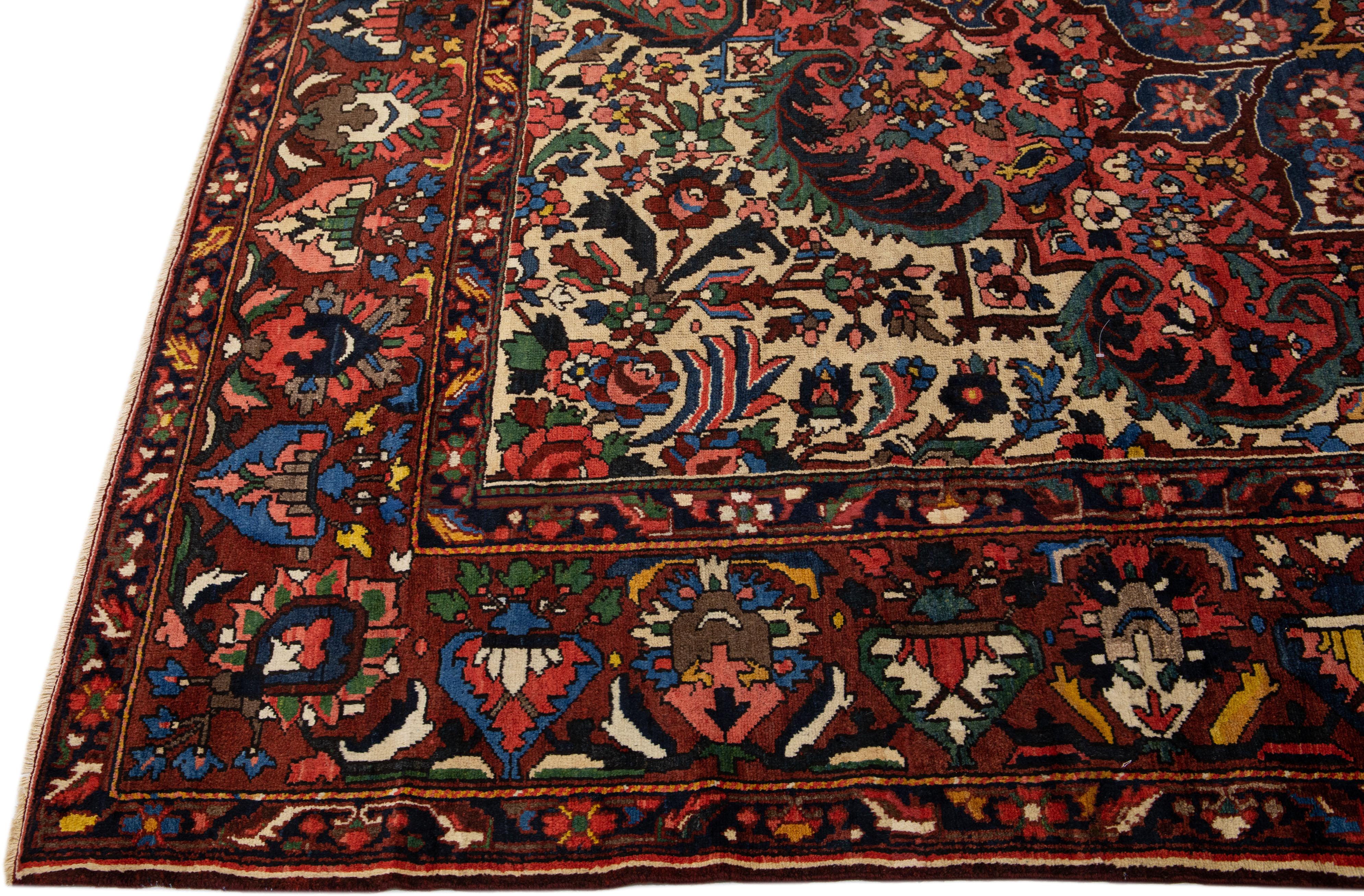 Islamic Antique Persian Bakhtiari Red Handmade Wool Rug with Multicolor Rosette Design For Sale