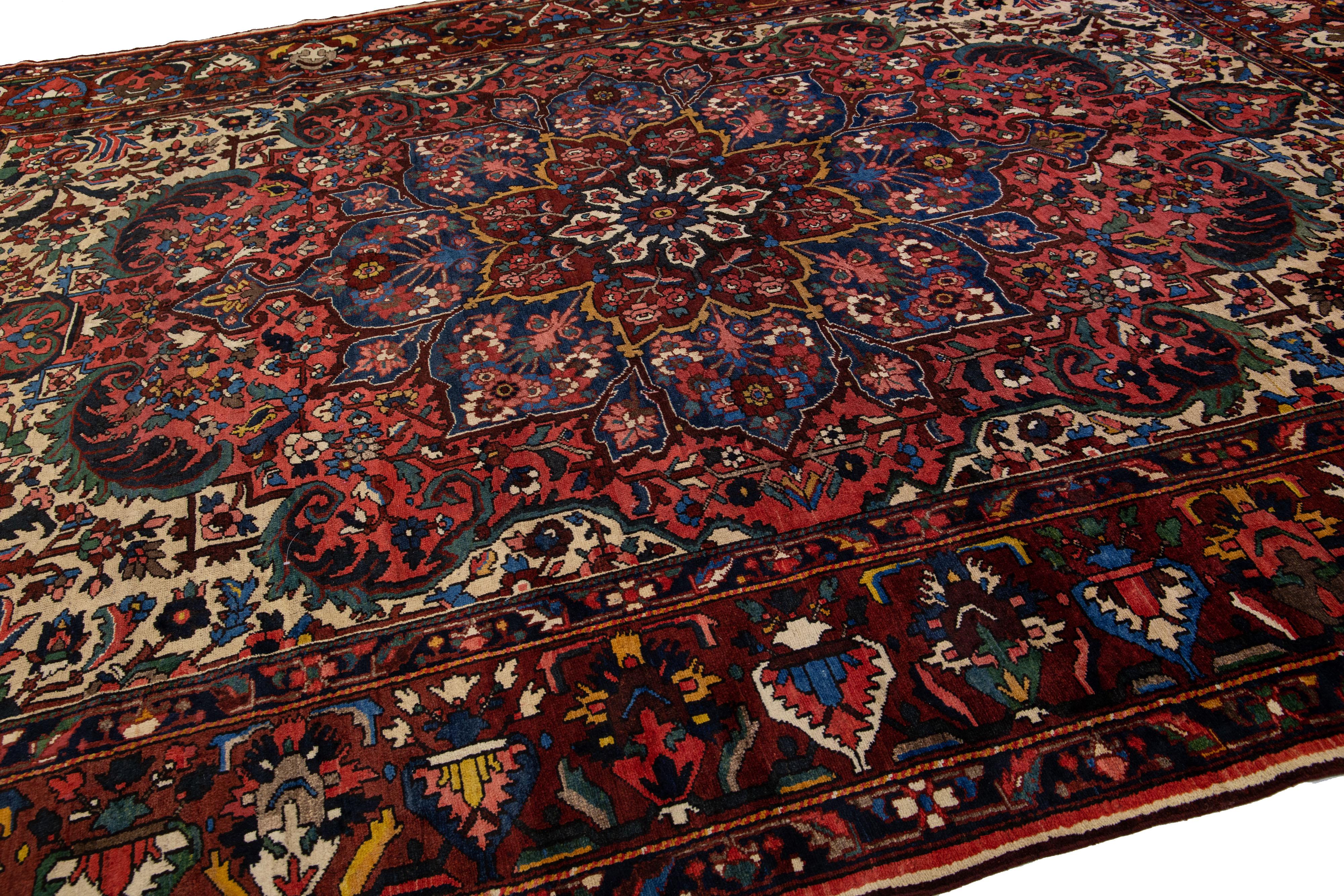 Hand-Knotted Antique Persian Bakhtiari Red Handmade Wool Rug with Multicolor Rosette Design For Sale