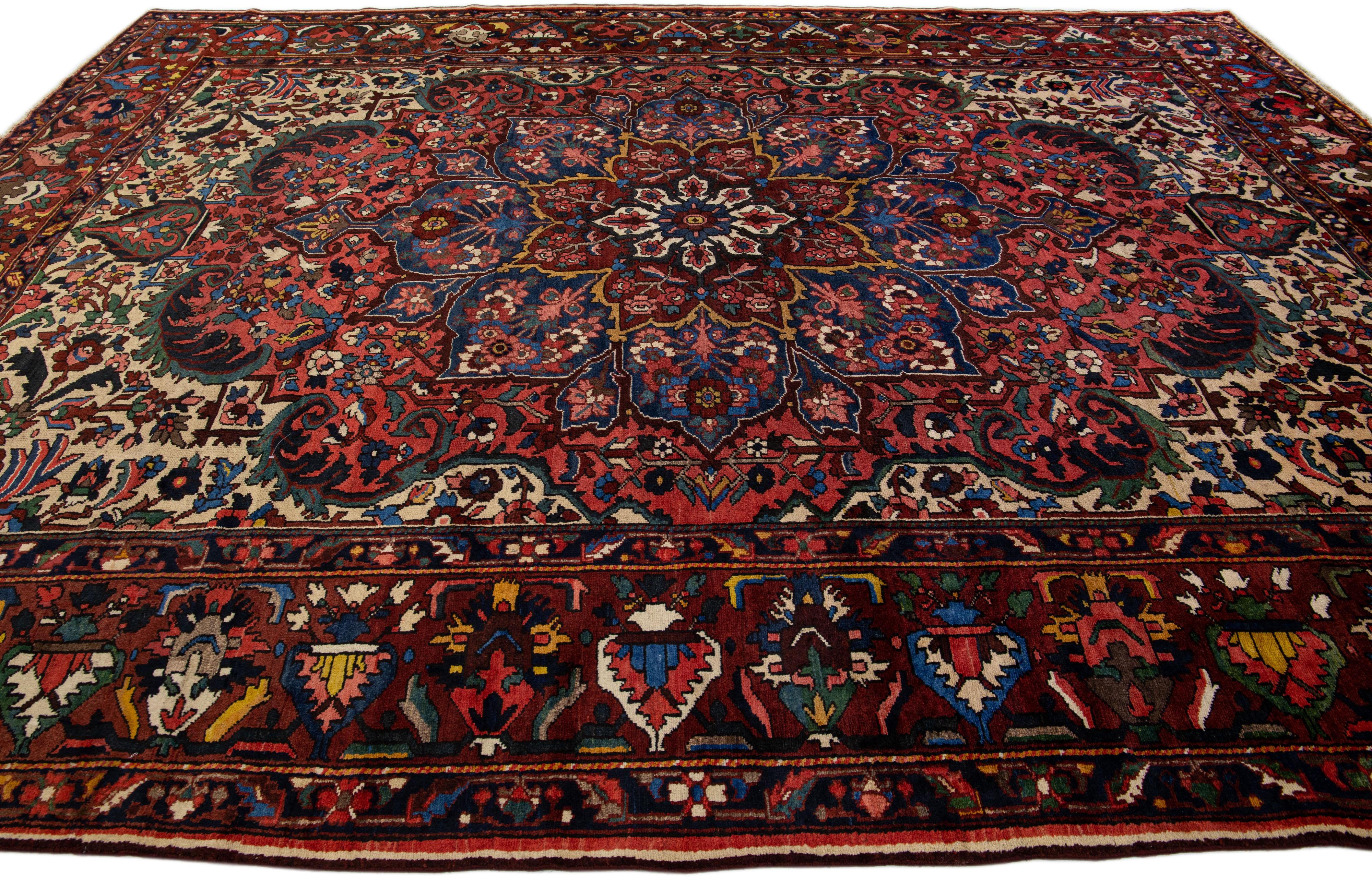 20th Century Antique Persian Bakhtiari Red Handmade Wool Rug with Multicolor Rosette Design For Sale