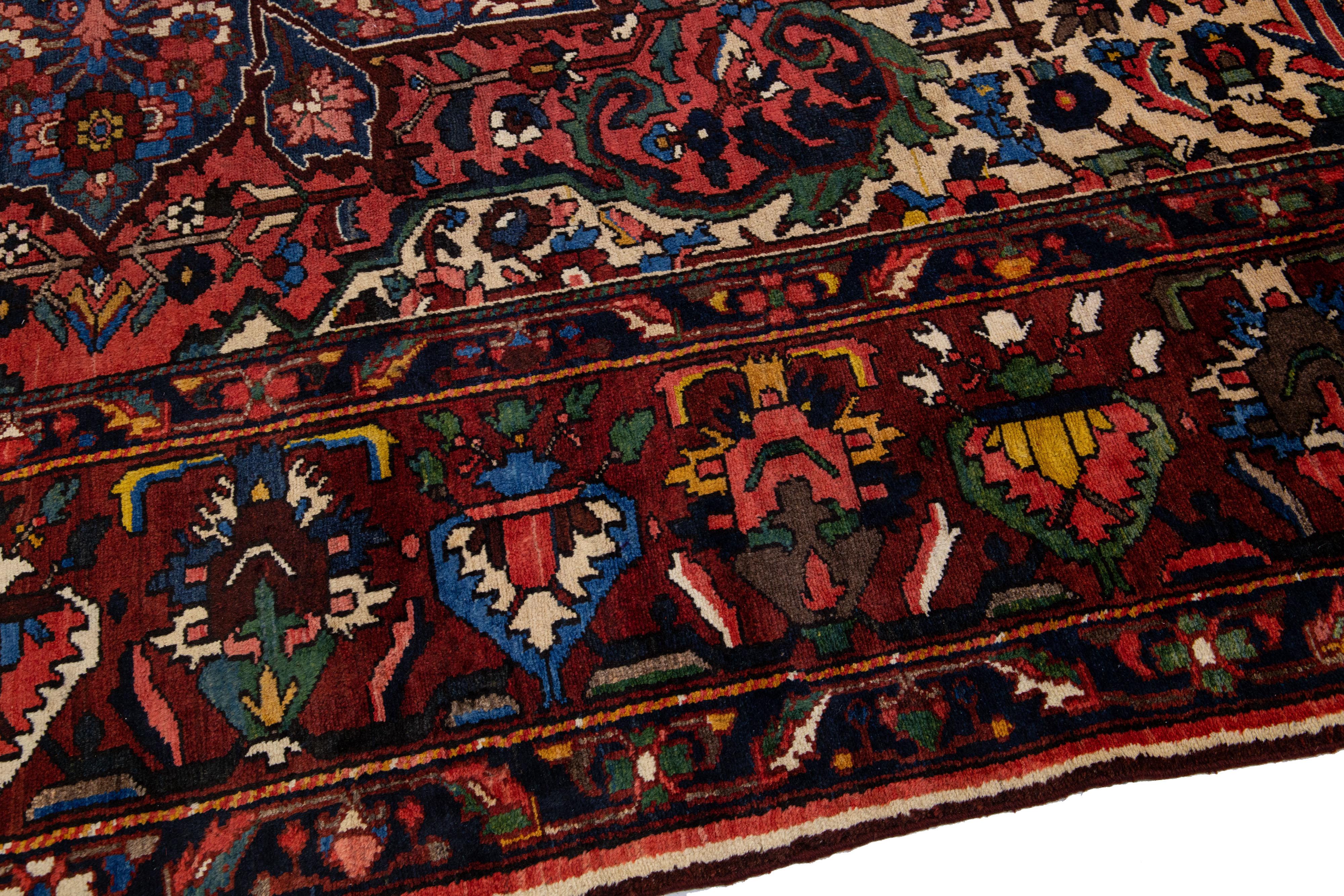 Antique Persian Bakhtiari Red Handmade Wool Rug with Multicolor Rosette Design For Sale 1