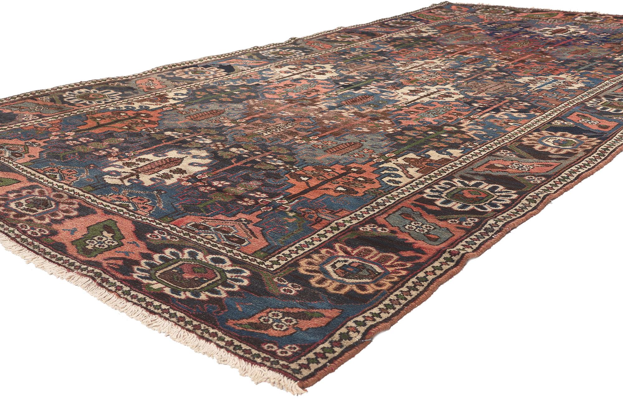 75325 Antique Persian Bakhtiari Rug, 05'00 X 09'09.
Biophilic Design meets earth-tone decadence in this antique Persian Bakhtiari rug. The four seasons garden design and warm earthy hues woven into this piece work together creating a relaxed yet