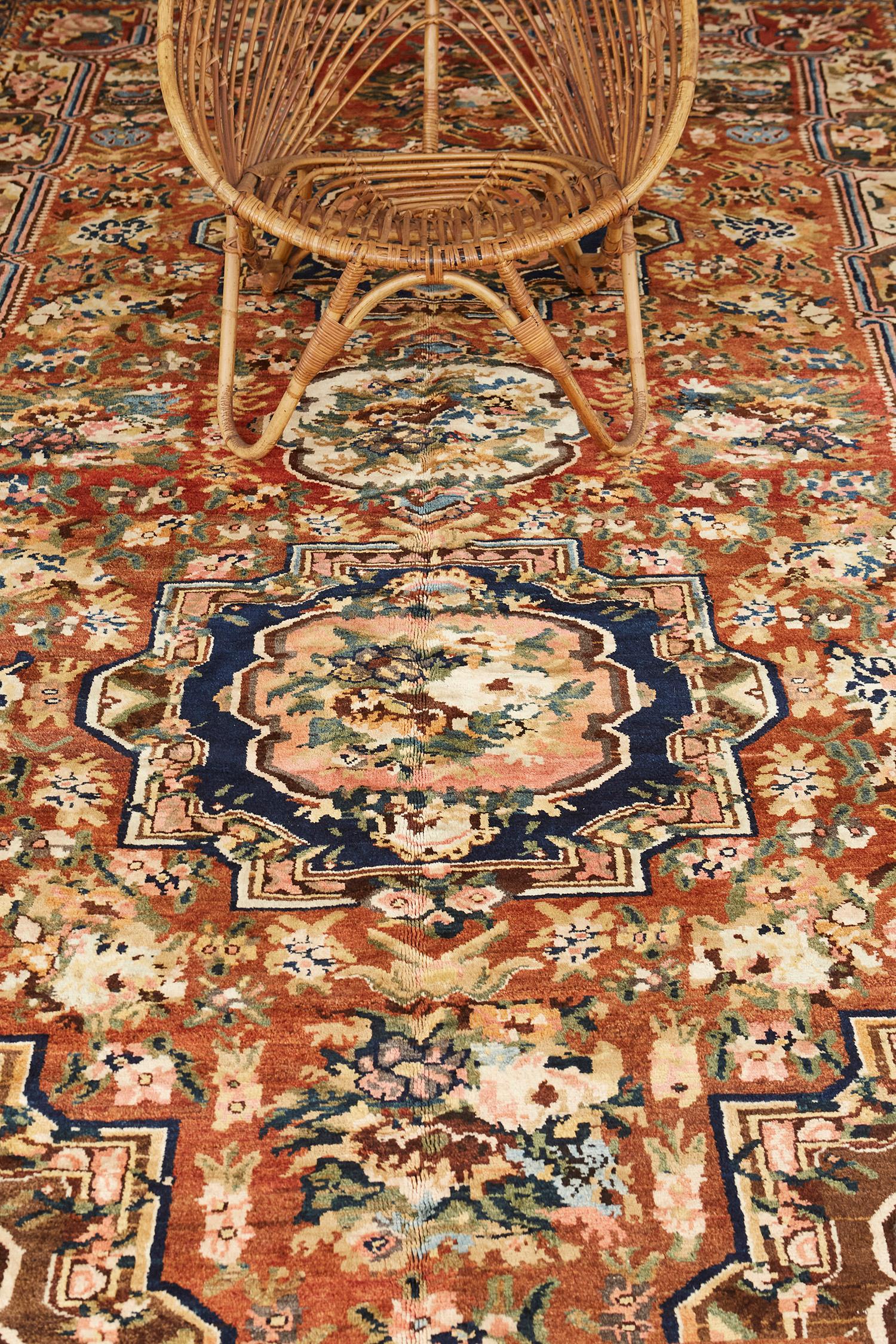 Featuring an interplay of stunning color palettes, this Antique Persian Bakhtiari Floral Design rug embodies a harmonious vibe captivating attention with its various design elements in an impeccable design. Effervescent geometric florals and