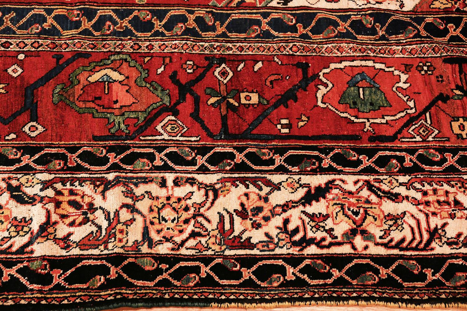 Stunning antique Persian Bakhtiari rug, Origin: Persia, circa 1900. Size: 11 ft 8 in x 14 ft (3.56 m x 4.27 m). This breathtaking carpet is the creation of the Bakhtiari people and was created over 100 years ago. The carpet is in excellent shape and