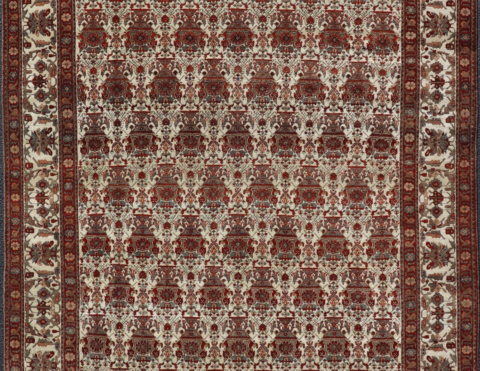 Measures: 6'7 x 9'9 
Antique Persian Bakhtiari Rug with an Elegant All-Over Floral Pattern 6'7 x 9'9. Keivan Woven Arts/ rug/A24-0909, country of origin / type: Iran / Bakhtiari, circa 1910.

This antique Persian Bakhtiari rug showcases an intricate