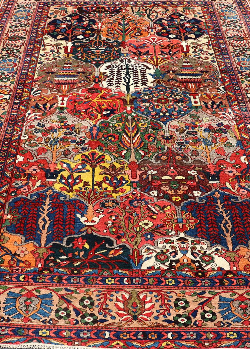 This magnificent Antique Bakhtiari Rug features an all-over diamond garden design replete in with a large variety of bold colors. The central design is enclosed within a complementary multi-tiered border. 

All-over diamond design antique Persian
