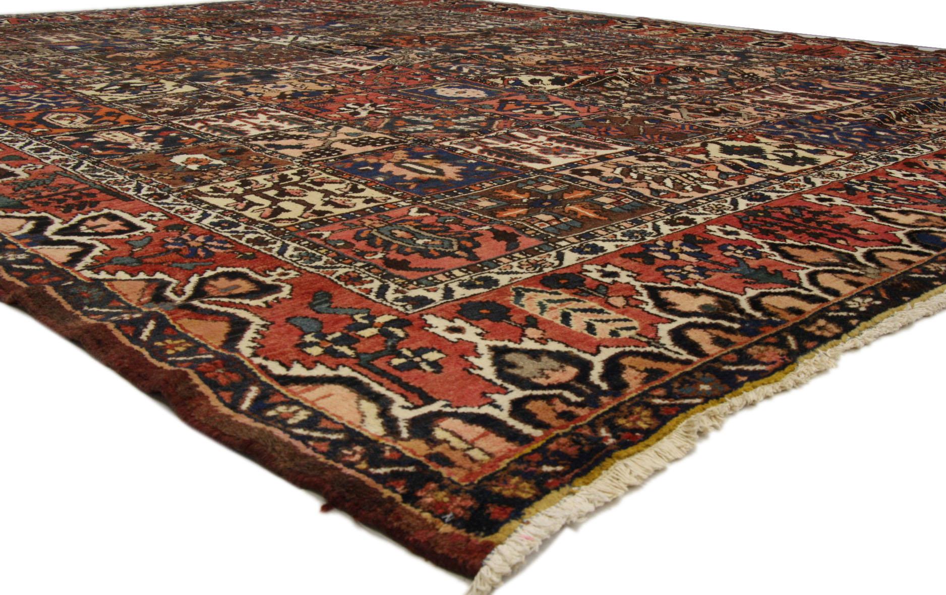 Refined colors integrated with a rich patina, this hand-knotted wool antique Persian Bakhtiari rug features the four Seasons design with a traditional modern style. Classically composed and boasting a truly magnificent four seasons panel compartment