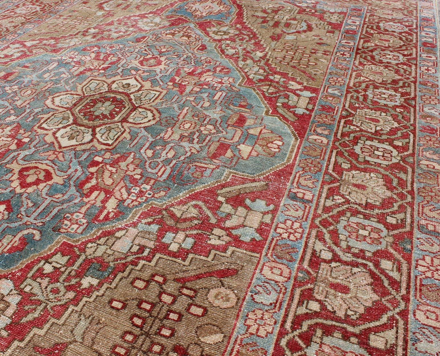 Early 20th Century Antique Persian Bakhtiari Rug with Layered Floral Medallion Design and Motifs For Sale