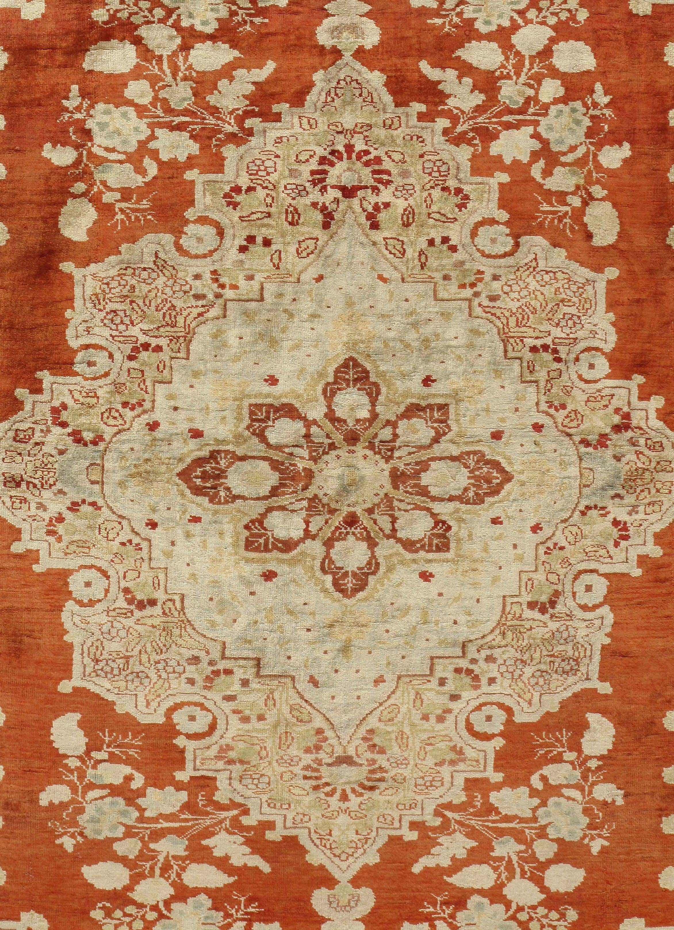 Antique Persian beige silk Tabriz rug. Size: 4'2 x 5'7. This is a Classic silk Tabriz from the most desirable period of Tabriz weaving. The complex layered medallion is framed by extended quarter motives in the traditional style. The rust red field