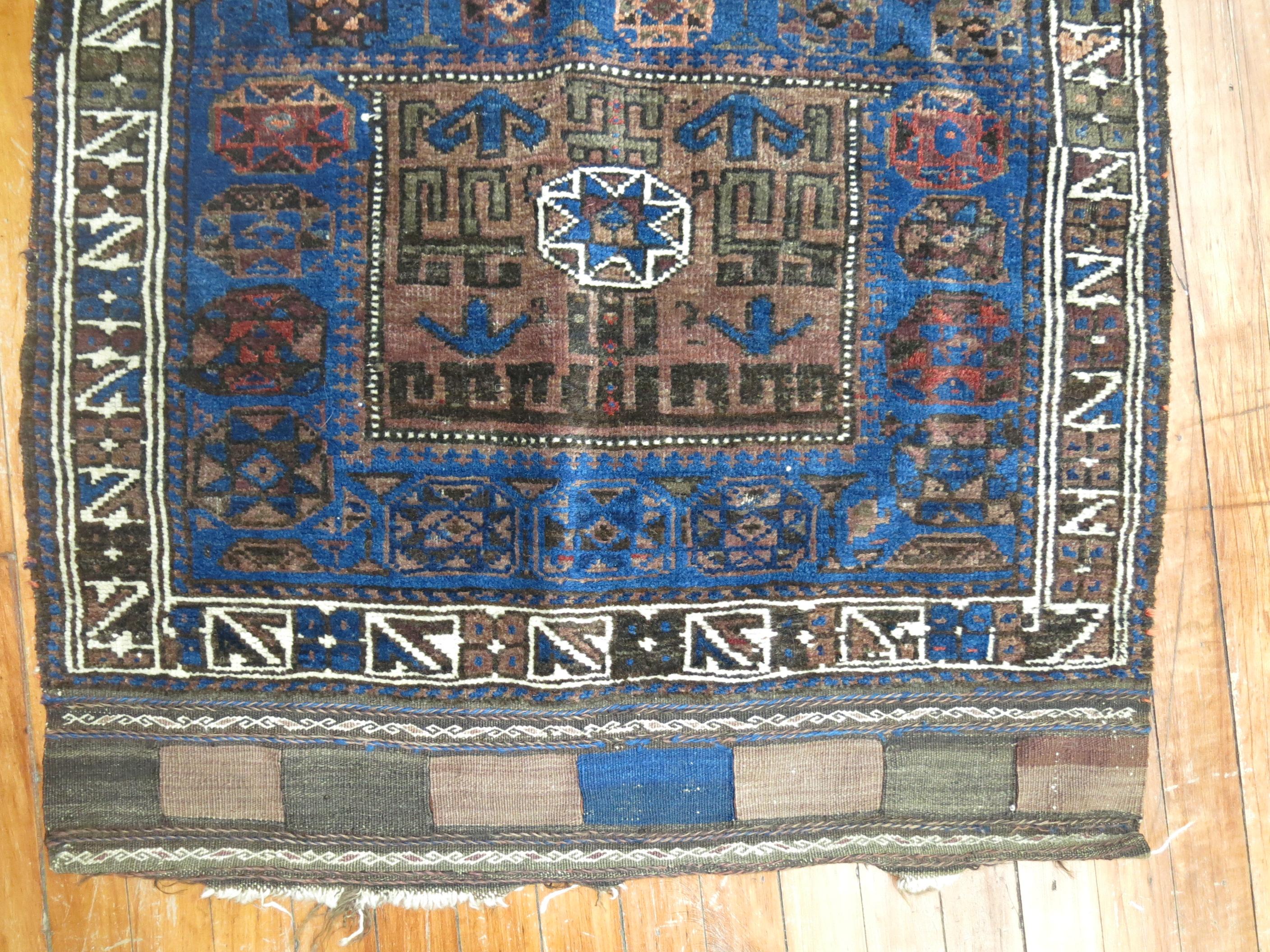 19th century Persian Beshir rug with vivid blues and brown.