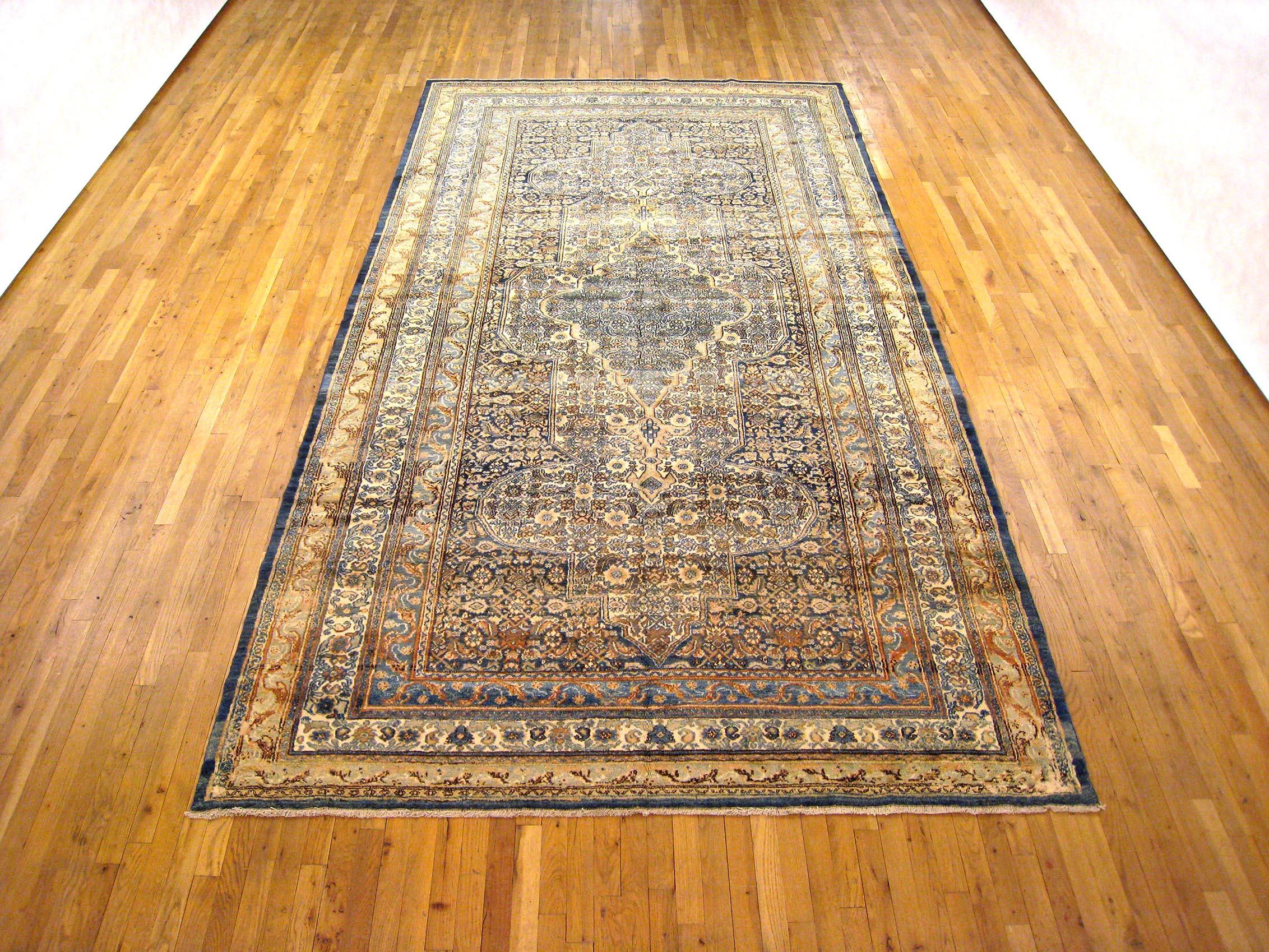 Antique Persian Bibikabad oriental rug, gallery size.

An antique Persian Bibikabad oriental rug, size 12'9
