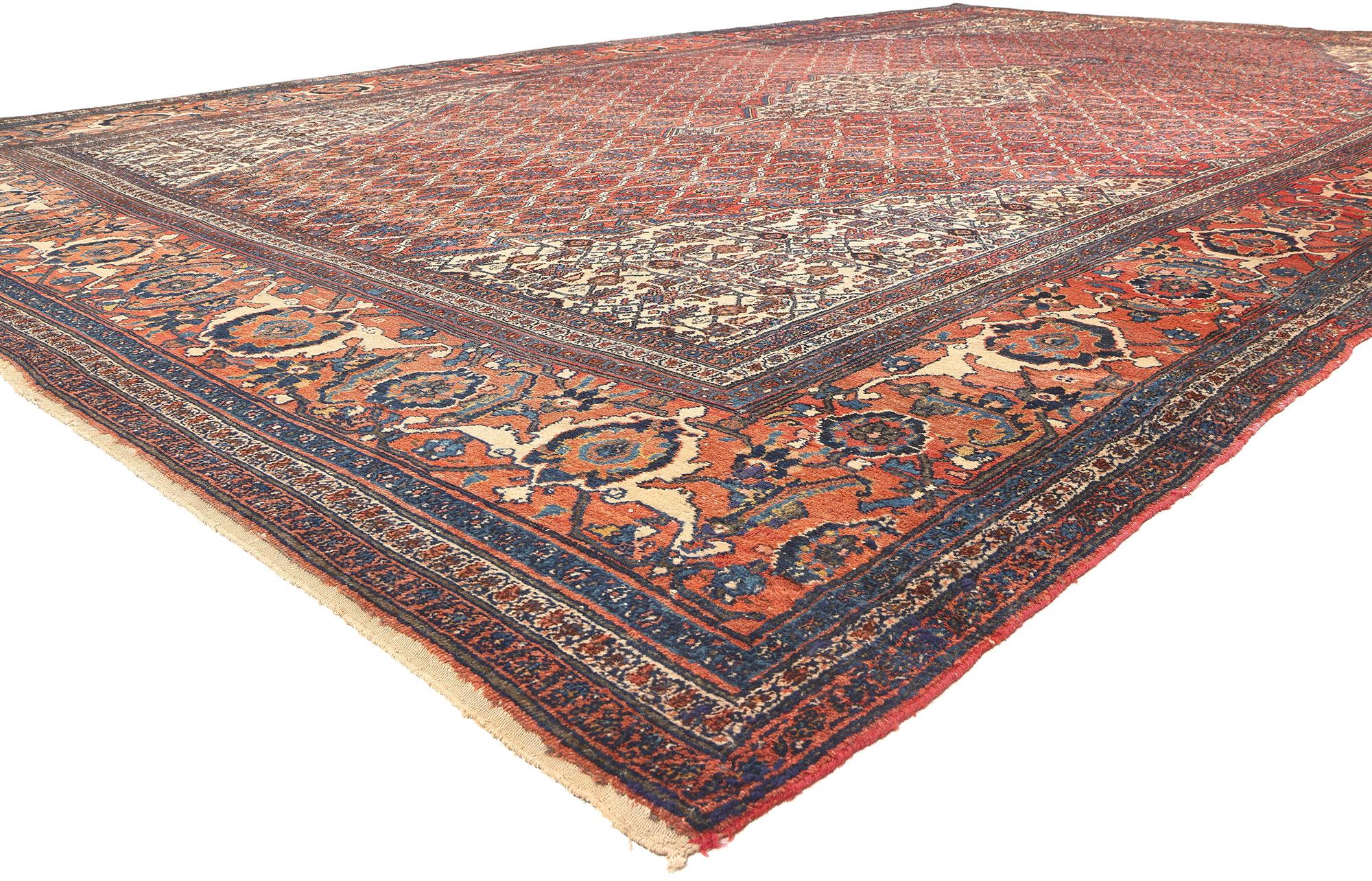 78091 Oversized Antique Persian Bibikabad Rug, 12'11 x 20'00. Step into the enchanting embrace of rustic elegance with this hand-knotted wool oversized antique Persian Bibikabad rug – an Adirondack-inspired wonder that effortlessly blends ornate