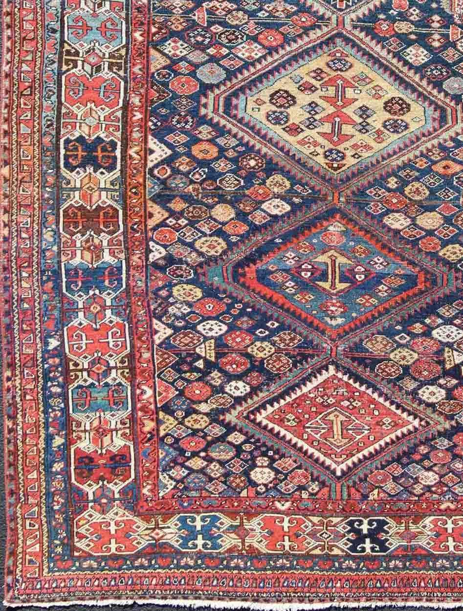 Blue and red antique Persian Hamedan rug with vertical diamond multi-medallions, rug ema-7563, country of origin / type: Iran / Hamedan, circa 1890.

This magnificent antique Hamedan features beautiful coloration, including tones of blue, red,