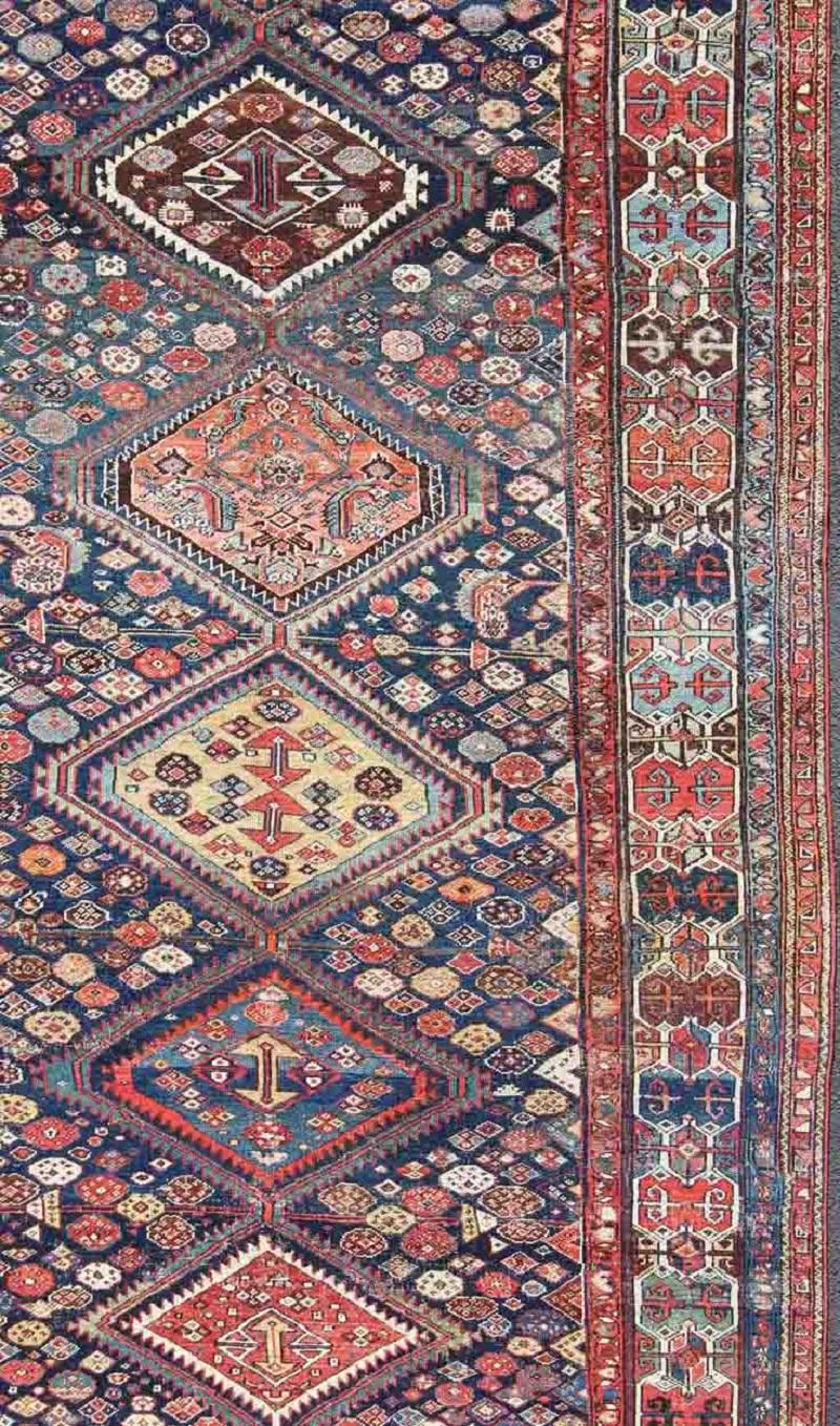 Hand-Knotted Antique Persian Bibikabad Rug with Diamond Medallions in Blue Background For Sale