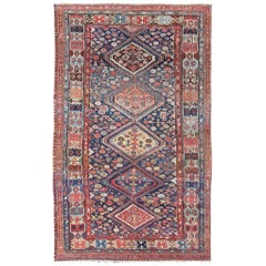 Antiker persischer Bibikabad-Teppich mit Diamantmedaillons auf blauem Hintergrund