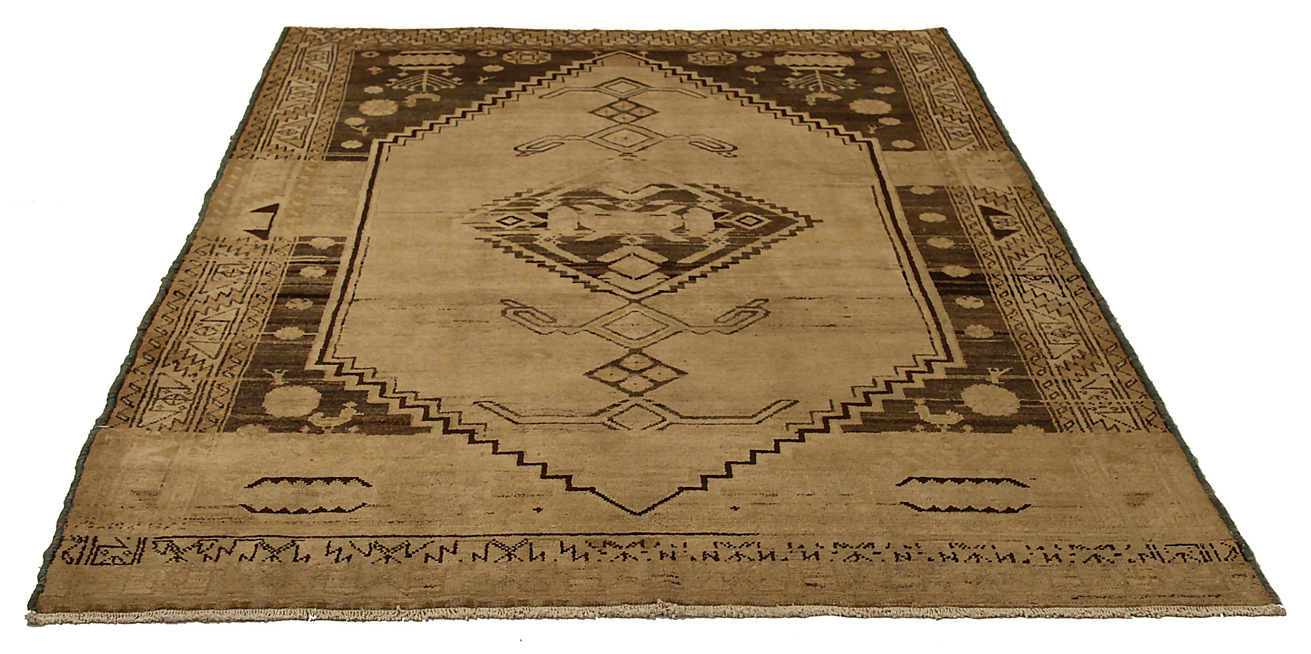 Antique Persian rug handwoven from the finest sheep’s wool and colored with all-natural vegetable dyes that are safe for humans and pets. It’s a traditional Bibikabad design featuring geometric and tribal details in brown a beige field. It’s a