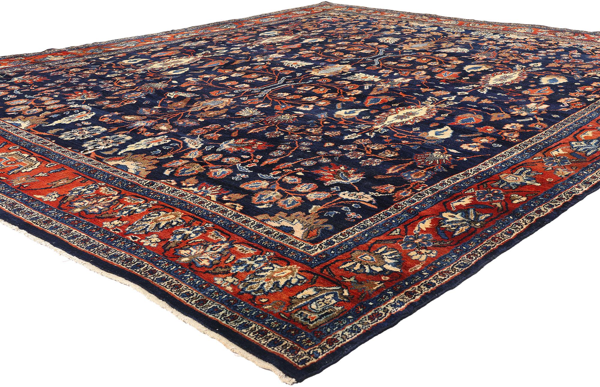 77575 Antique Persian Bibikabad Rug, 10'08 x 12'08. A captivating orchestration of floral rhythm and age-old craftsmanship, this hand-knotted wool antique Persian Bibikabad rug unfolds like a garden eternal—its deep midnight-blue field blooming with