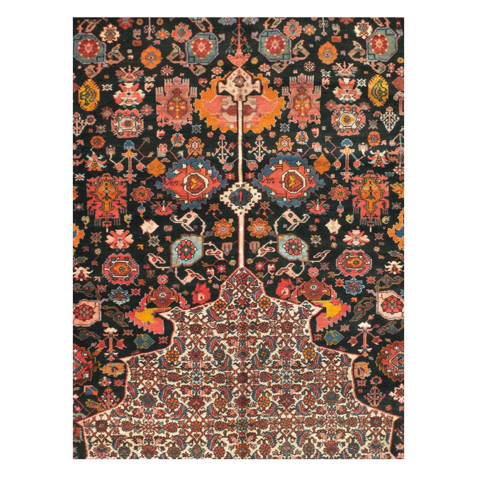 An antique Persian Bidjar 14' x 23' oversize rug handmade during the early 20th century.

Measures: 13' 10