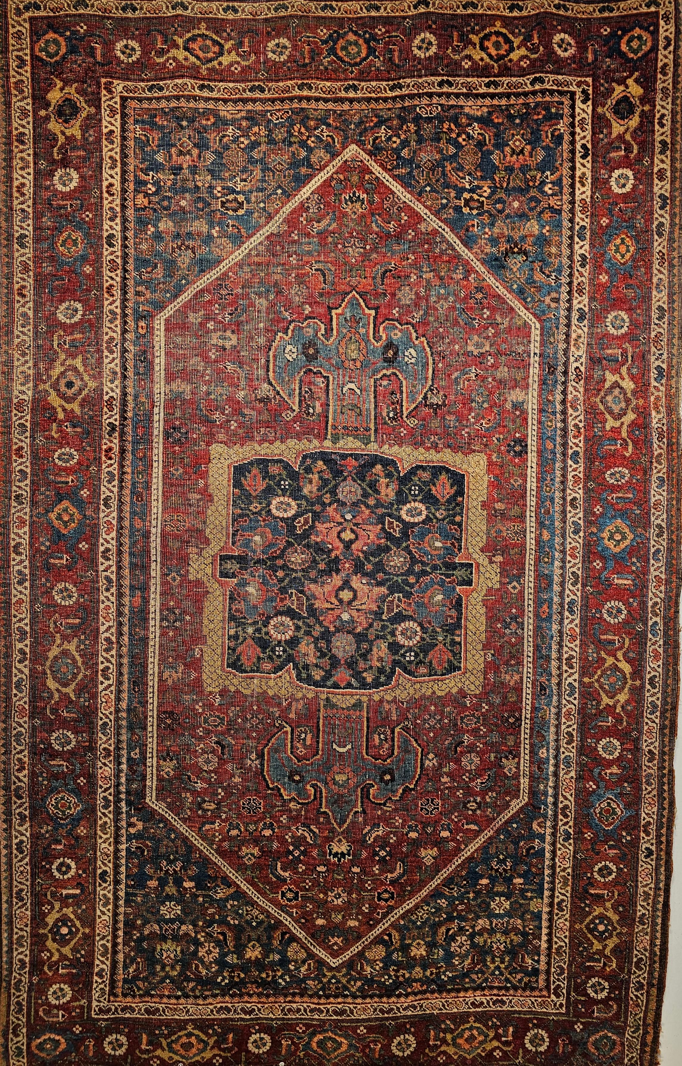 Beautiful 19th century Persian Bidjar area rug with a medallion design in a Herati geometric pattern in burgundy, French blue, and navy blue colors.   The rug has a combination of an abrash French blue and rich burgundy field colors.    The center