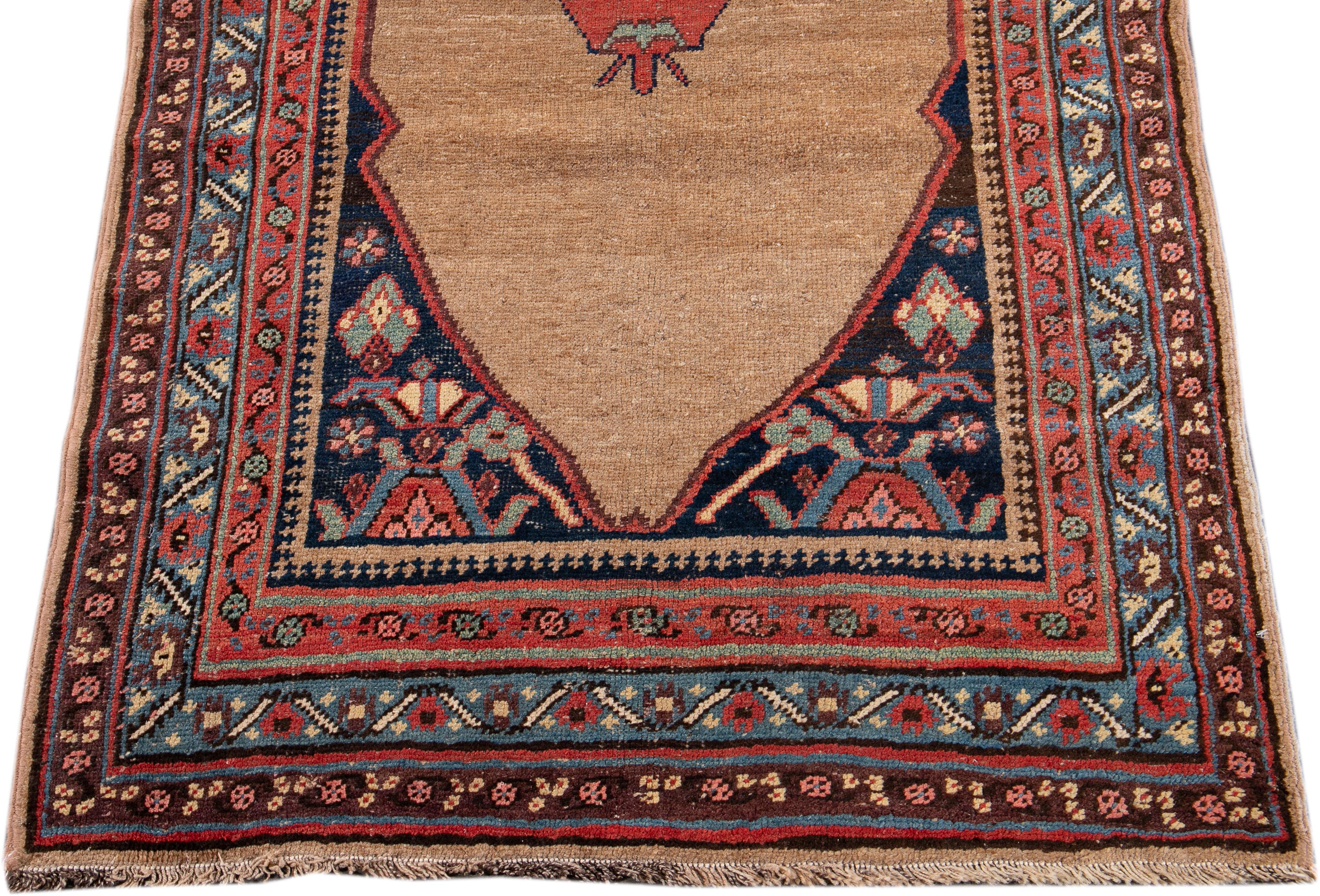 Beautiful antique Bidjar hand-knotted wool runner with a brown color field. This Bidjar rug has a designed frame with blue, pink, and red accents in a gorgeous all-over tribal design.

This rug measures 3'5