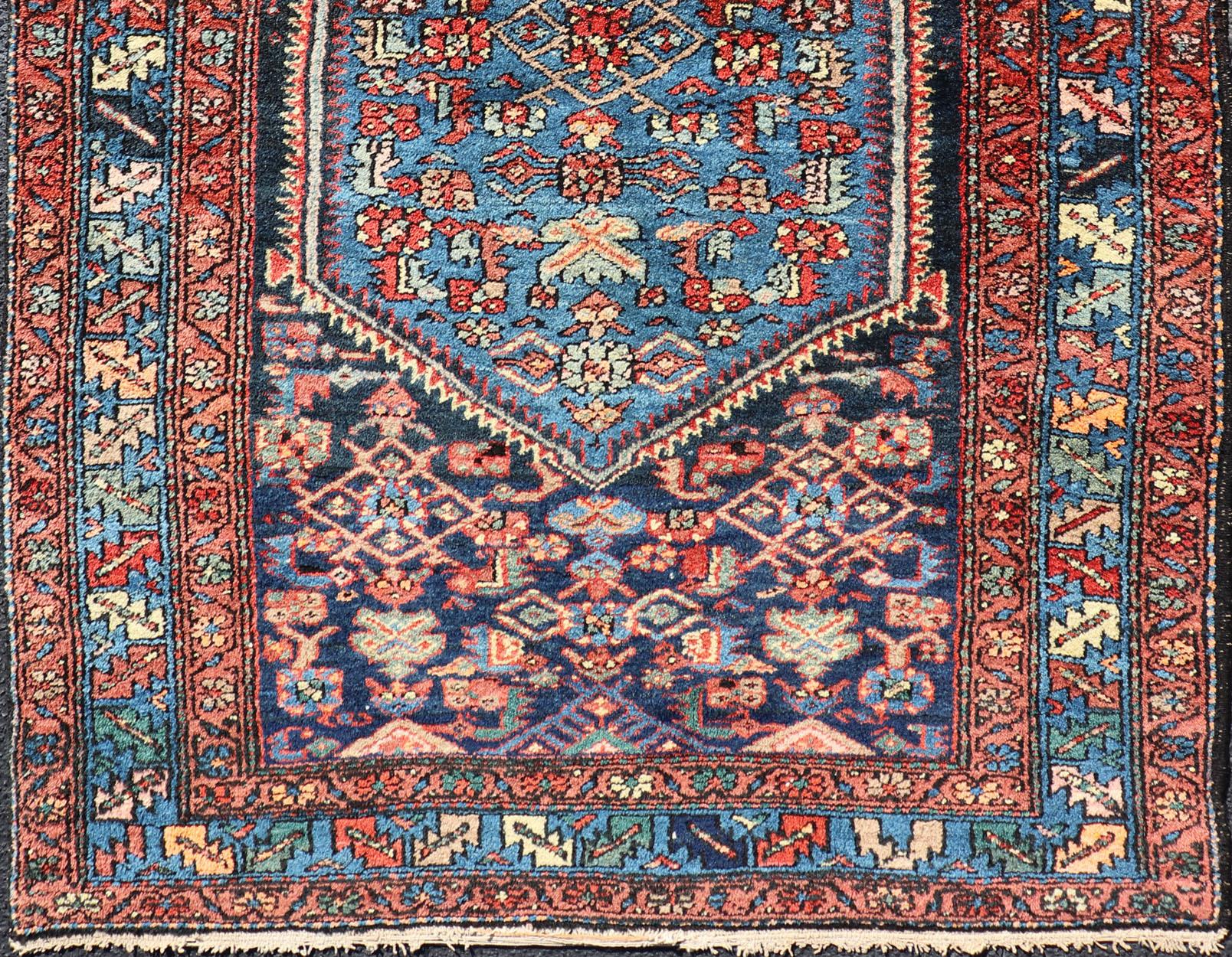 Hand-Knotted Antique Persian Bidjar Carpet with Variety of Blue Colors, Red, and Salmon For Sale