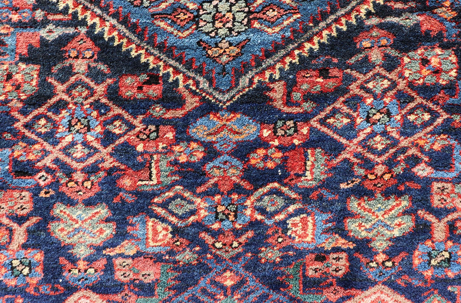 Wool Antique Persian Bidjar Carpet with Variety of Blue Colors, Red, and Salmon For Sale