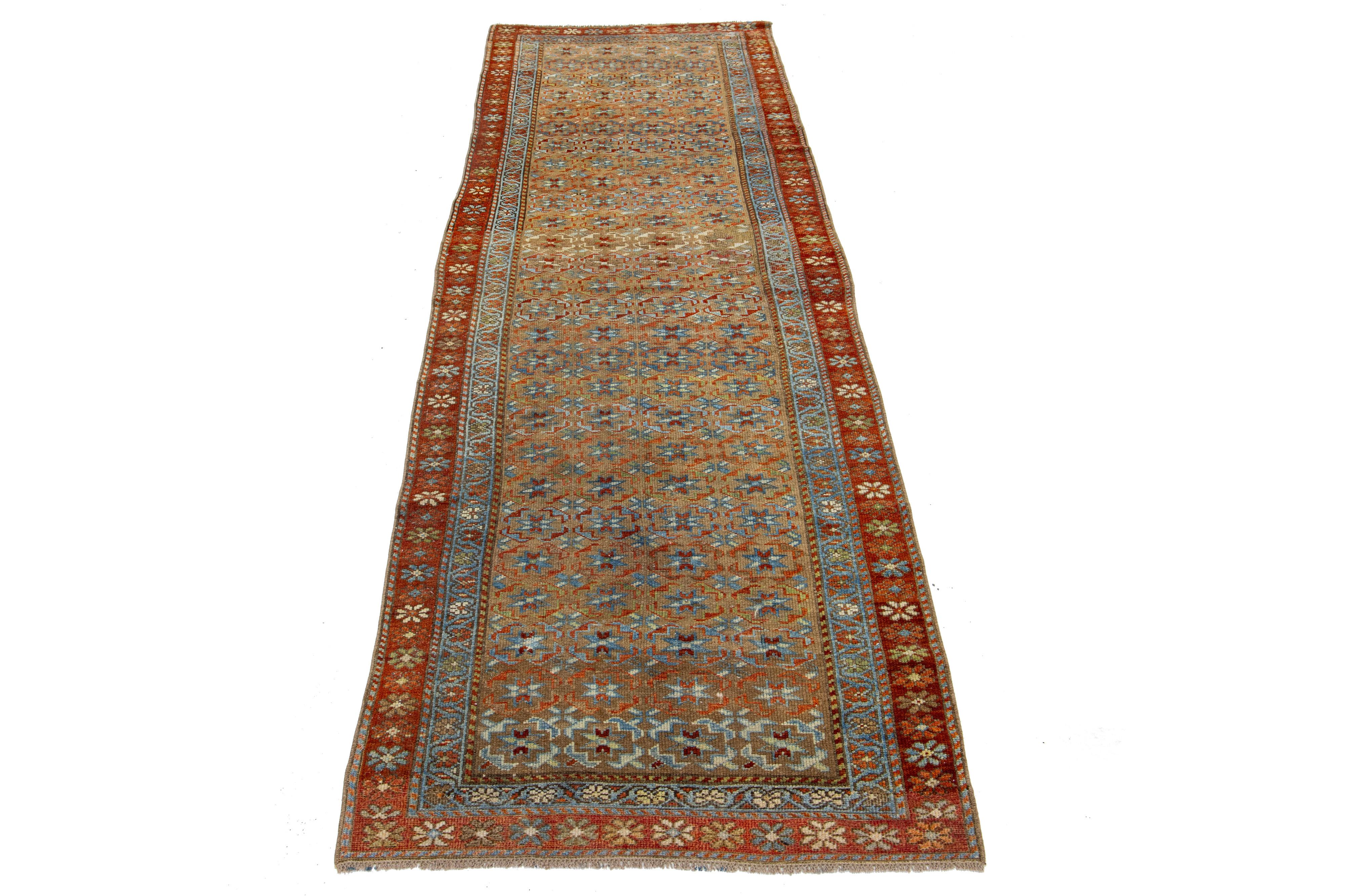 Beautiful antique Bidjar hand-knotted wool runner with a brown color field. This Bidjar rug has a designed frame with beige, rust, and blue accents in a gorgeous all-over design.

This rug measures 2'11