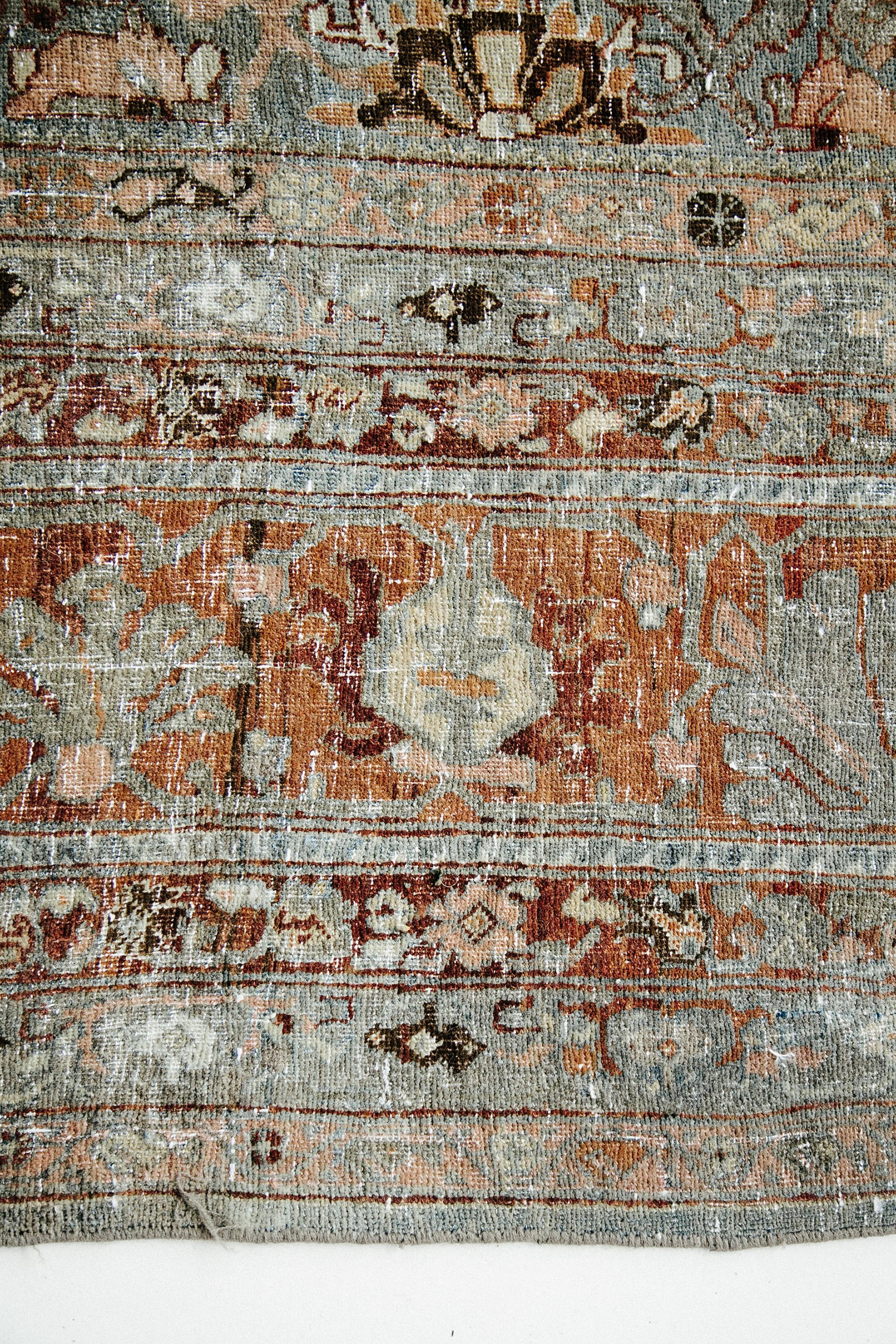This fine Persian Bidjar rug features a large-scale floral and vine design throughout. The inner border contains a floral design set against a red background, while the outer border contains a light blue background.

Rug Number
26521
Size
13' 6