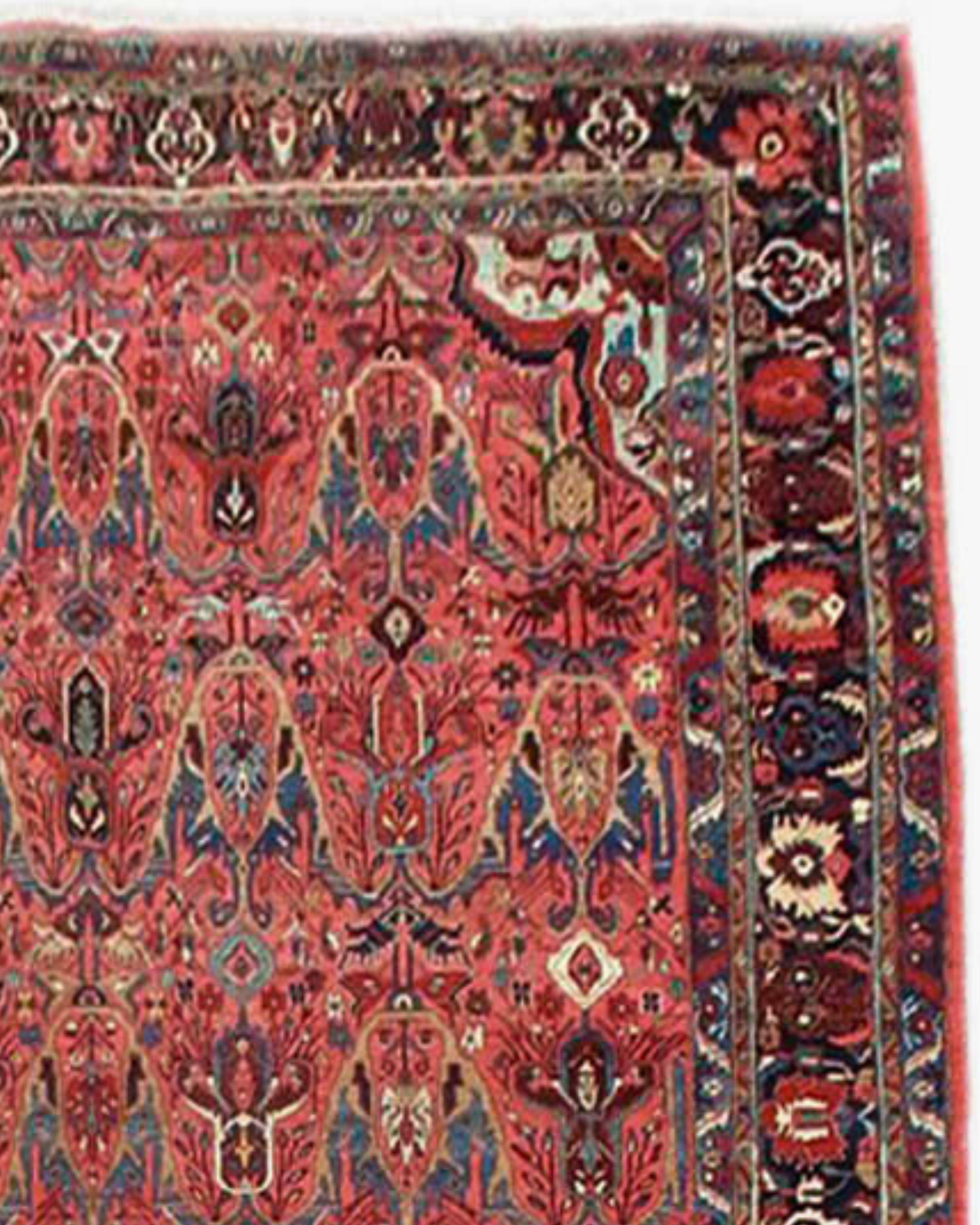 Antique Persian Bidjar Rug, Early 20th Century

Rows of alternating stylized Persian palmettes are drawn against the rose-madder ground of this elegant Bidjar carpet. Though it incorporates an allover field design, the rug also features small