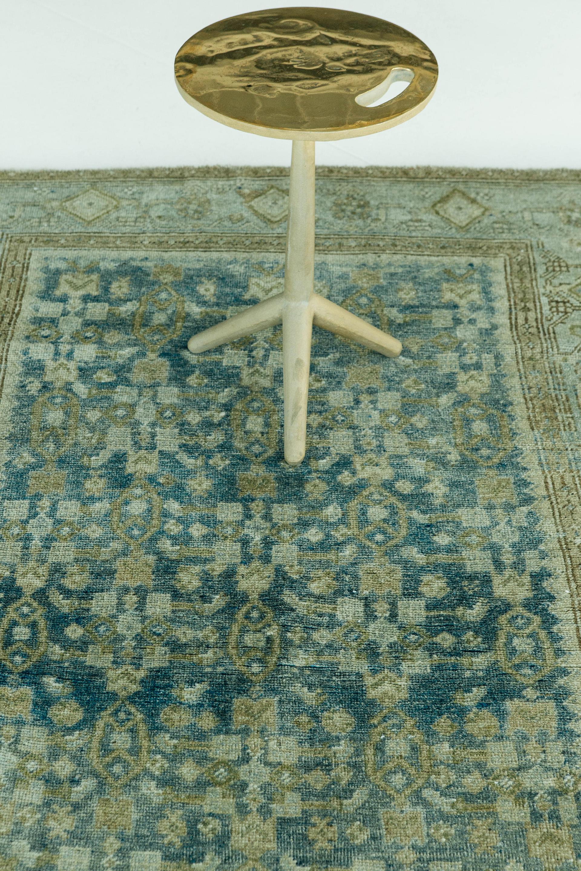 Field of teal Abrash with pale umber and ivory all-over geometric motifs. The composition is framed by a border of large scale geometric elements and stylized rosettes in grisaille tones on a turquoise ground.

Rug number: 27201
Size: 3'11