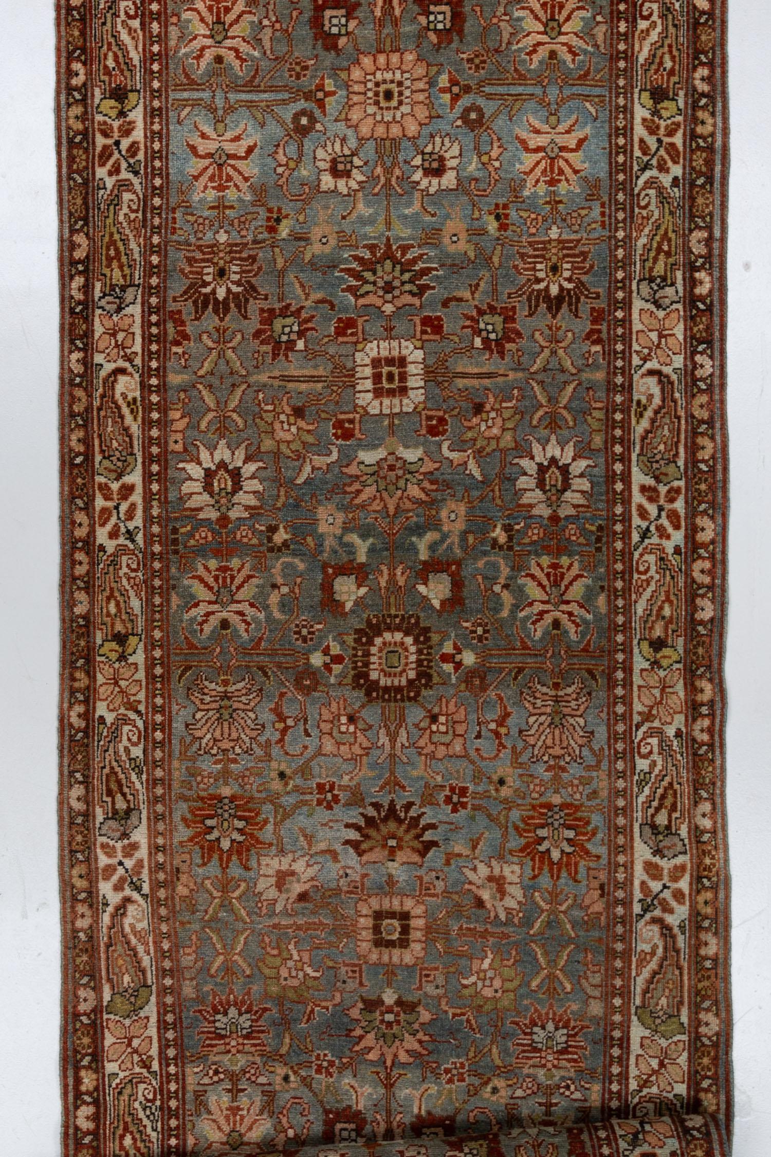 Discover the exquisite artistry of this 120 year old Persian Bidjar runner, a rare gem in both design and dimensions. The Bidjar rug, already renowned for its rarity, is uniquely presented in this unusual runner size, making it a standout addition