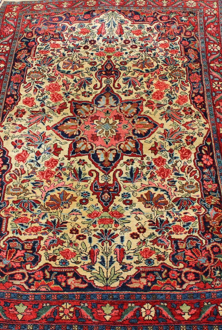 Early 20th Century Antique Persian Medallion Bidjar Colorful Rug In Ivory, Navy Blue and Red For Sale