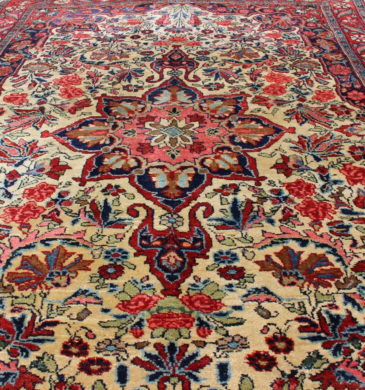 Wool Antique Persian Medallion Bidjar Colorful Rug In Ivory, Navy Blue and Red For Sale