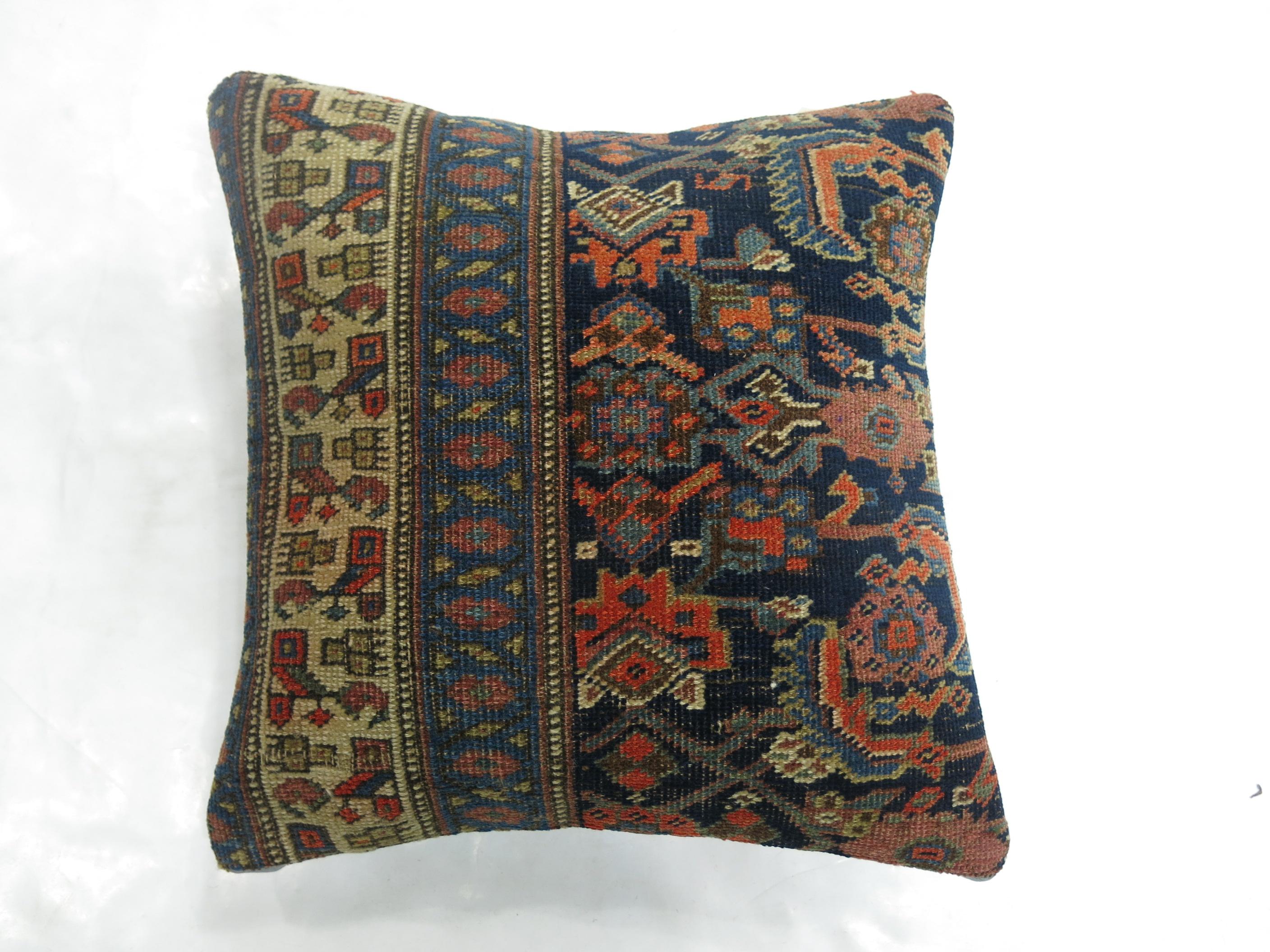 Pillow made from a turn-of-the-century Persian Bidjar rug. Polyfill insert and zipper closure included

Measures: 17'' x 17''.