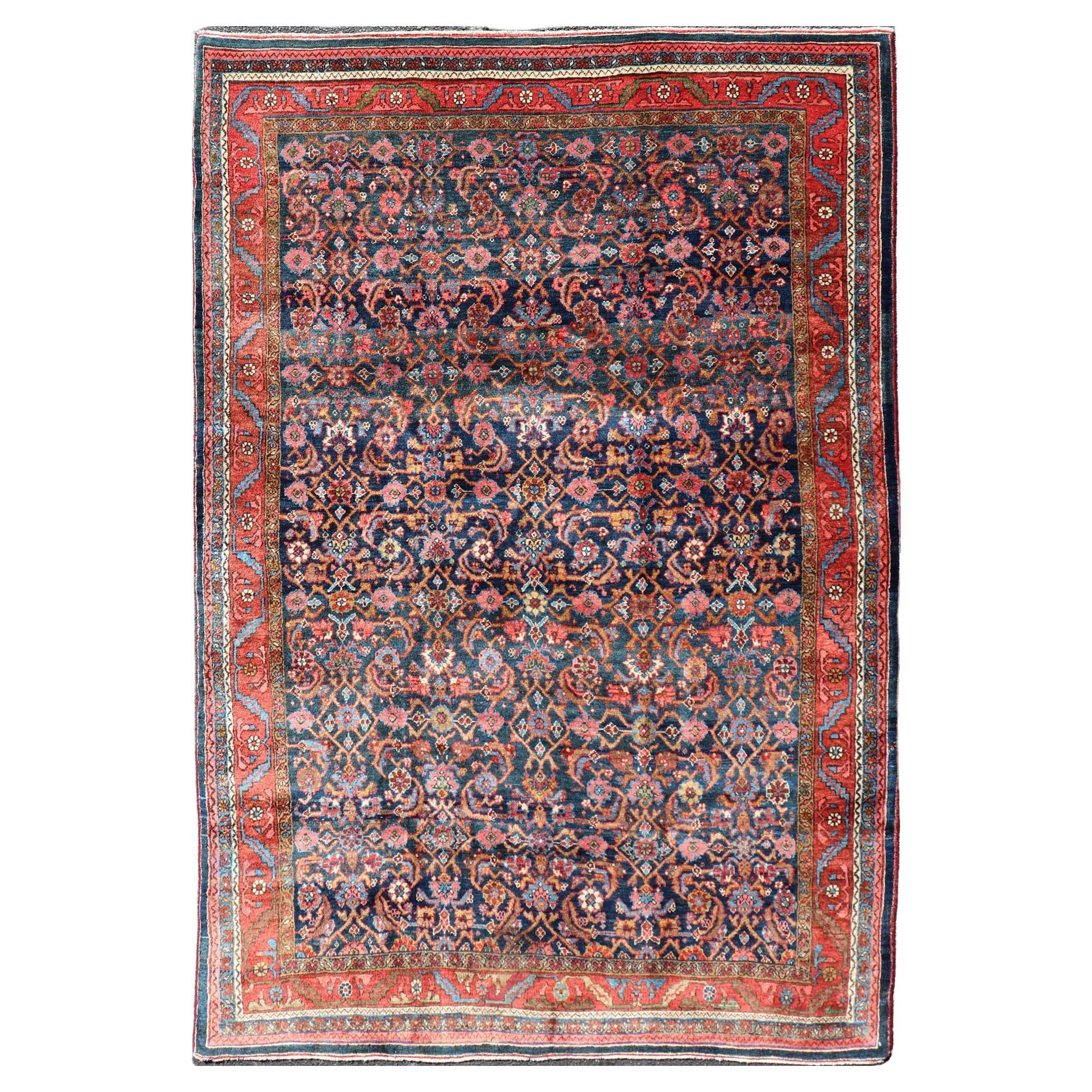 Antigua alfombra persa bidjar con diseño integral en rojo y azul 4'9 x 7'2
