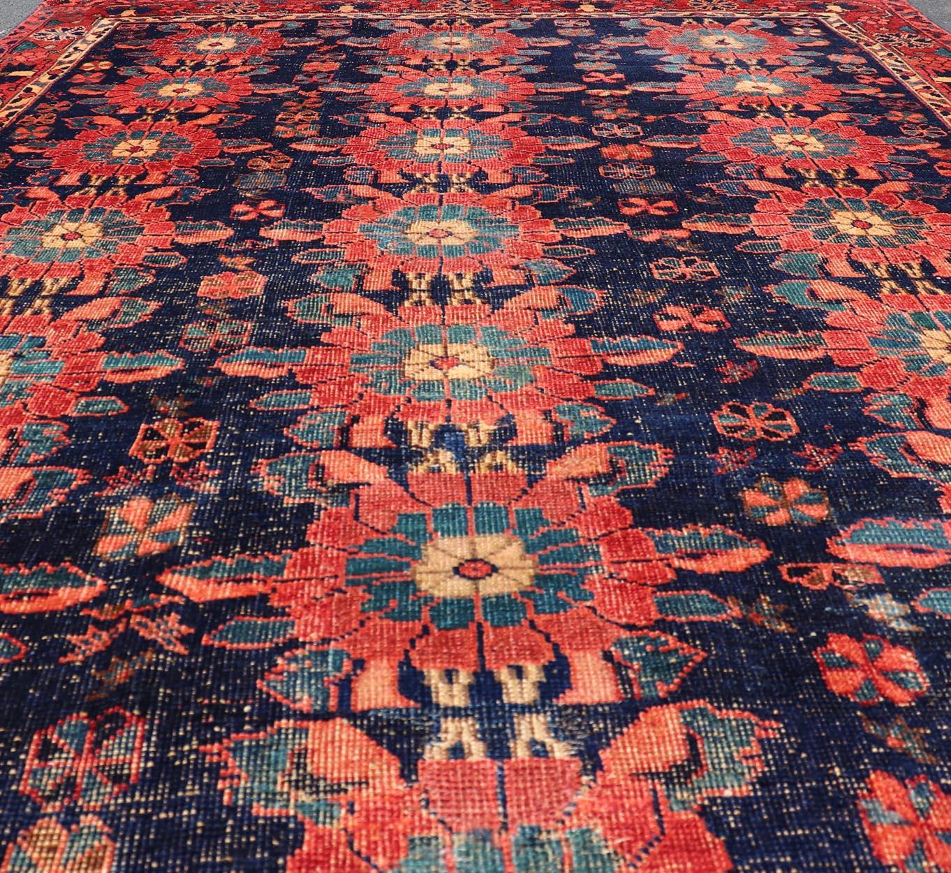Antique Persian Bidjar Rug with All-Over Floral Motifs in Red and Blue. Keivan Woven Arts / EMBC-9699-13819, country of origin / type: Iran / Bidjar, circa 1900
Measures: 5'0 x 7'9 
This antique Persian Bidjar carpet features multi colors and a