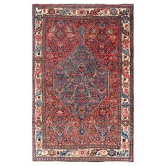 Tapis persan antique Bidjar à motifs de médaillons sub-géométriques sur tout le pourtour