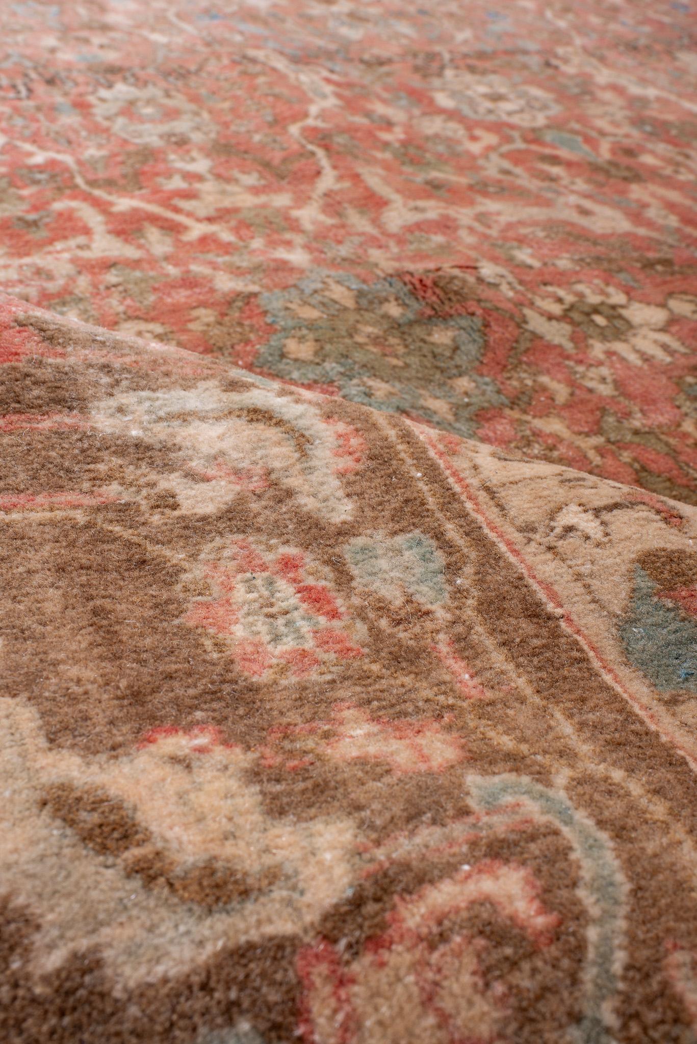 This Antique Persian Bidjar Rug features a geometric floral design in deep, rich colors. The bold patterns and vibrant hues make it a standout piece for traditional and eclectic interiors.
