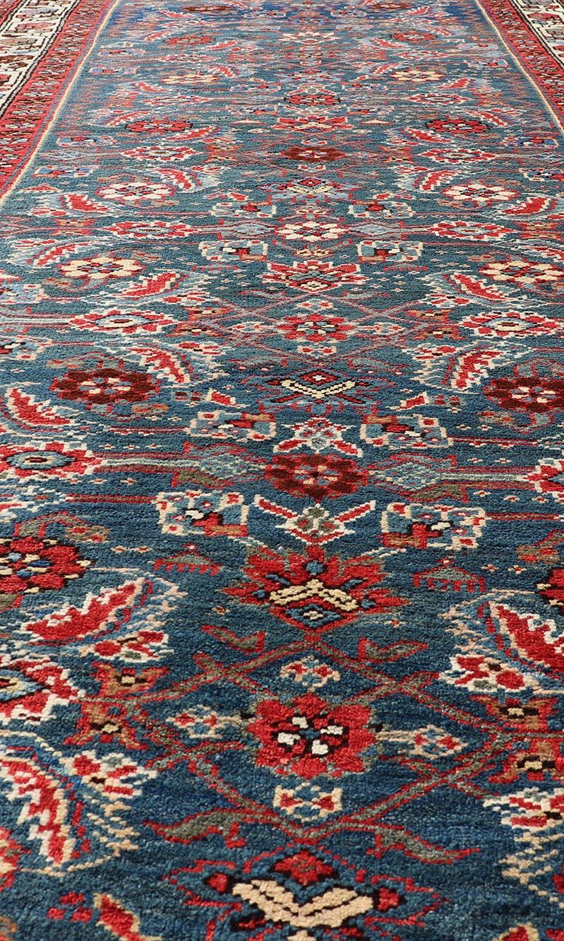 Wool Antique Persian Bidjar Rug with Large Floral Motifs in Blue, Red, and Ivory For Sale