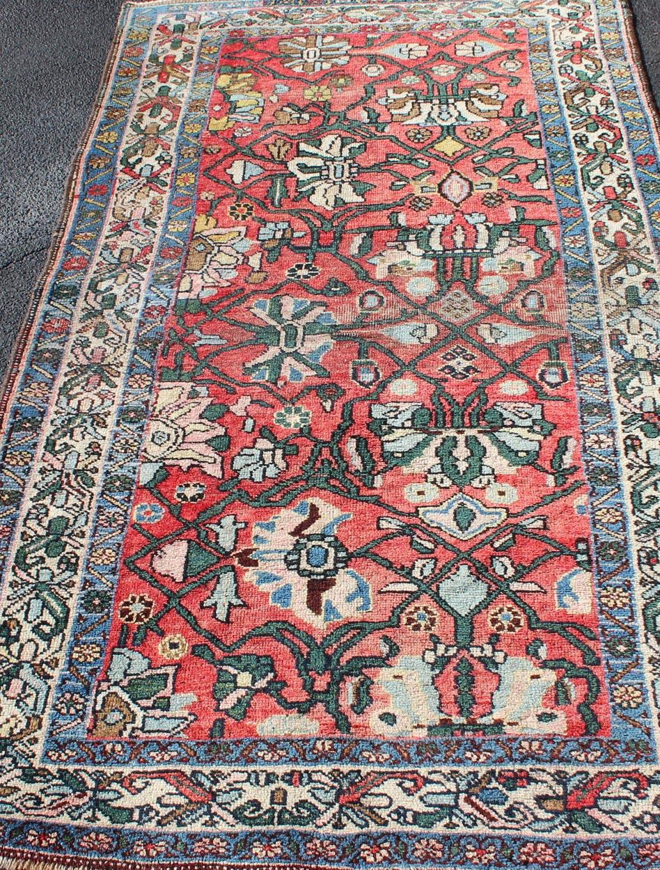 20th Century Antique Persian Bidjar Rug with Large Floral Motifs in Soft Red, Green & Blue For Sale