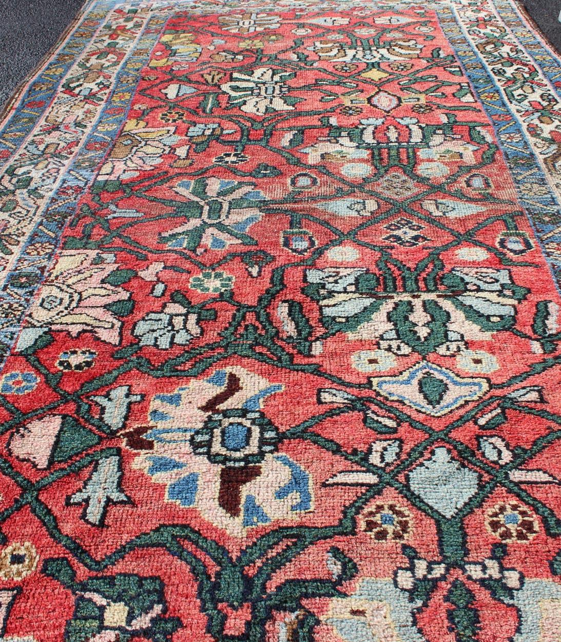 Wool Antique Persian Bidjar Rug with Large Floral Motifs in Soft Red, Green & Blue For Sale