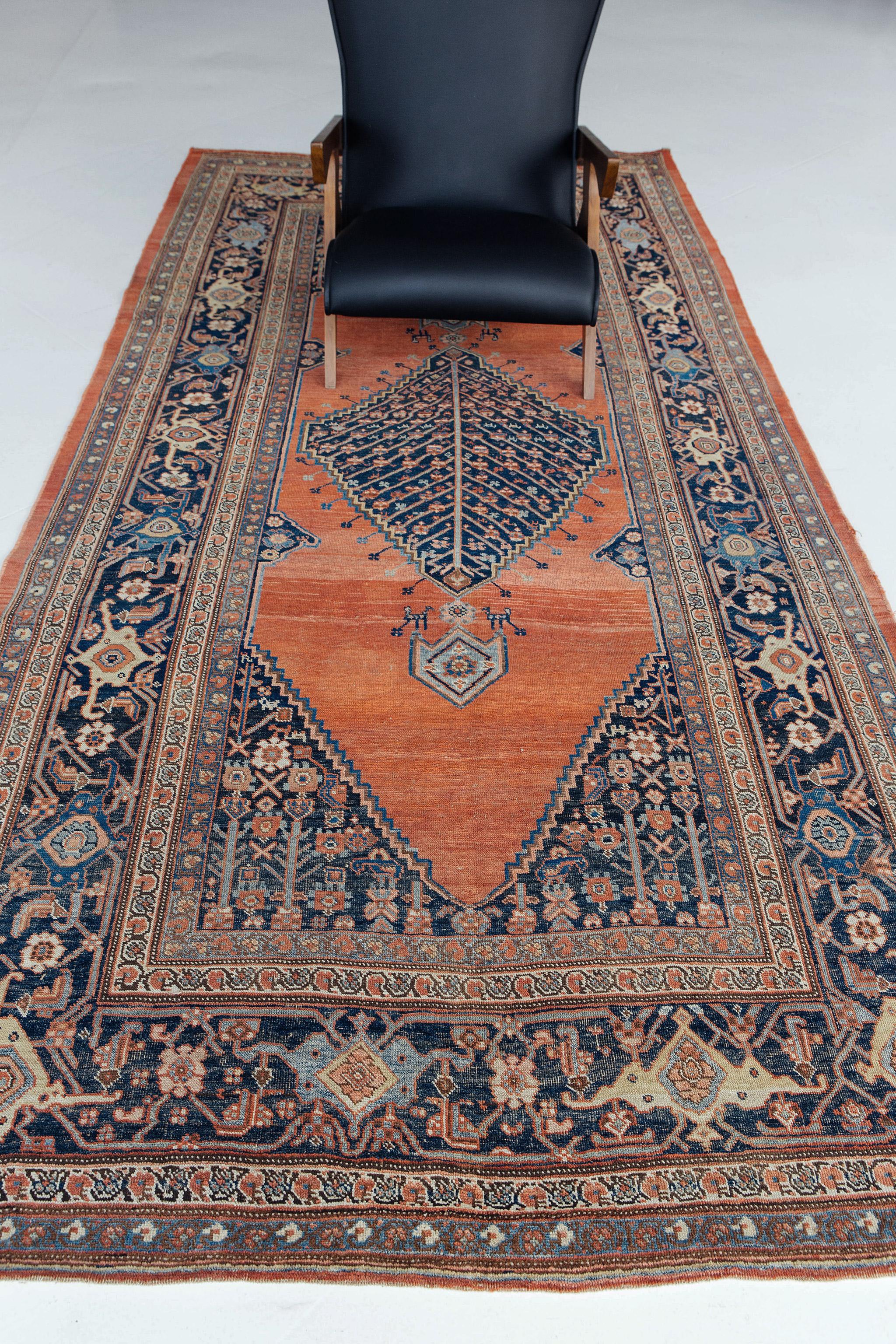 Persian Bidjar rugs are unique for their angular motifs, appearing almost like Caucasian rugs in their choice of color and arrangement. In this magnificent Persian runner rug, the arrangement is designed to cascade down in the traditional runner