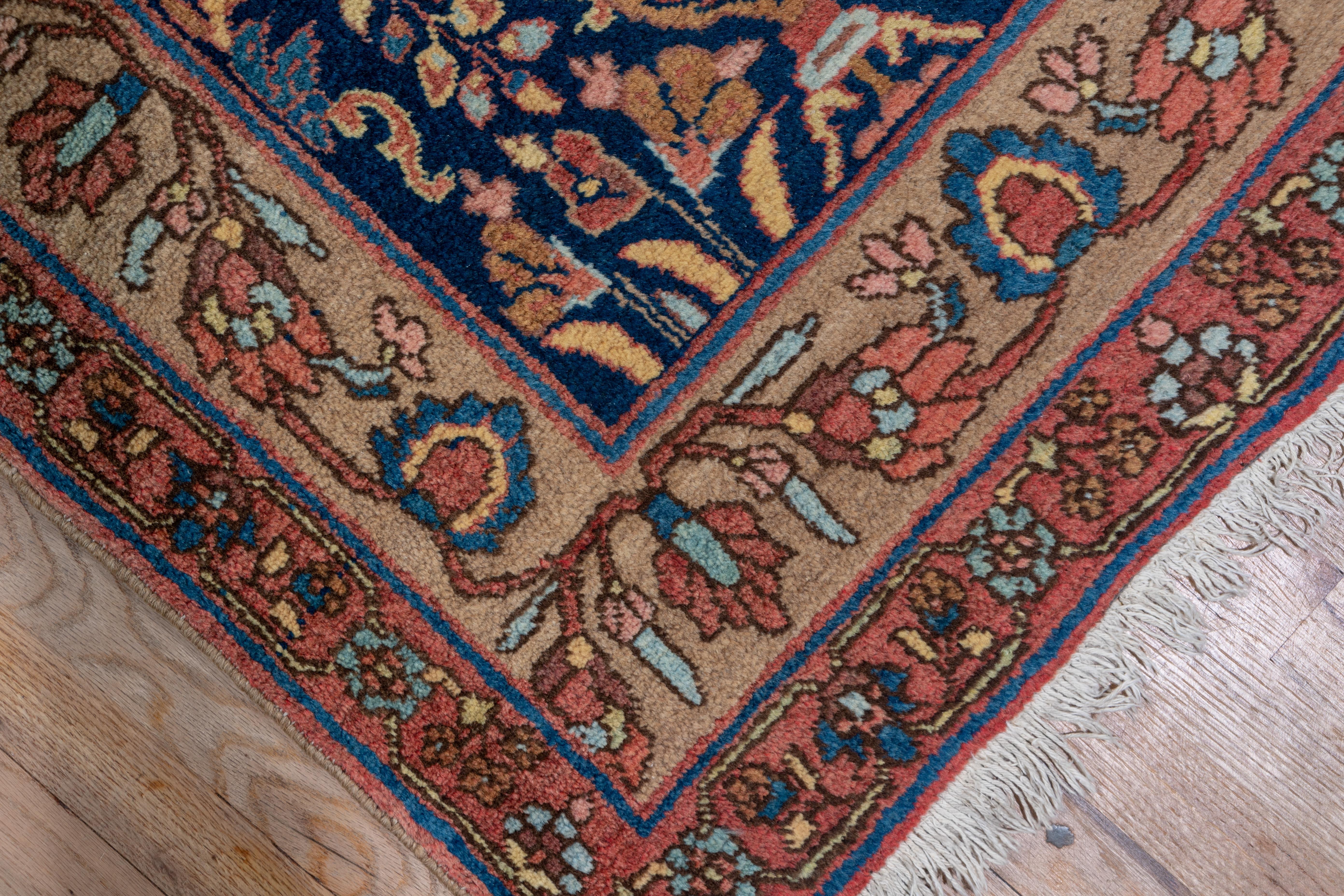 This versatile width west Persian rustic Kurdish kenare (renner) displays an abrashed blue field with an ascending tree, vase, flower and stem pattern accented in rose, green and light blue. Palmette and Meander main border. Solidly woven, medium
