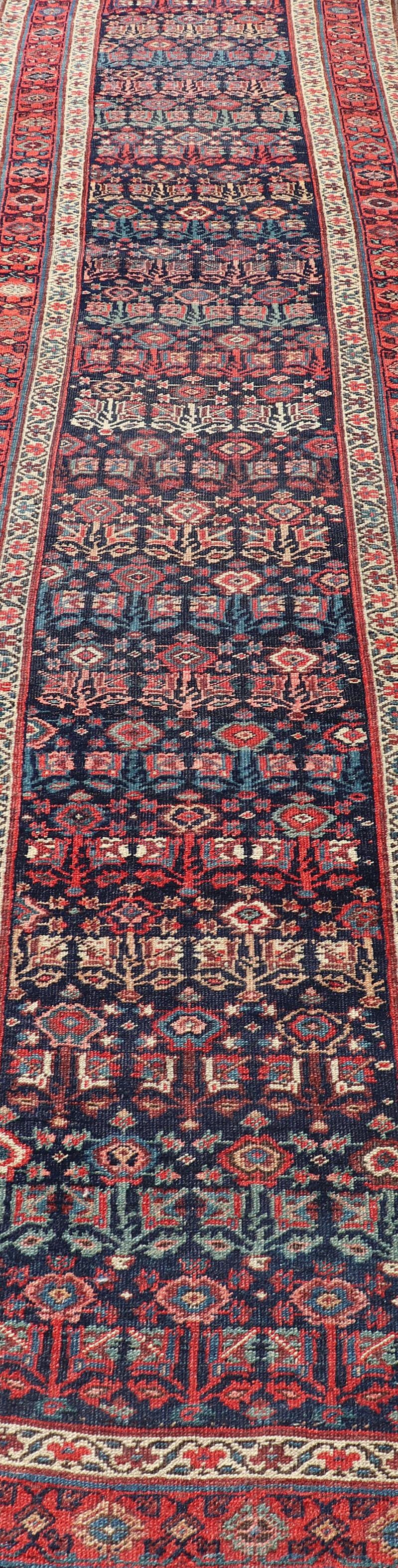 Antique Persian Bidjar runner with Sub-geometric design in ivory, red, and blue rug 13-1205, country of origin / type: Iran / Bidjar, circa 1900

This magnificent early 20th century Persian Bidjar runner brilliantly incorporates breath-taking