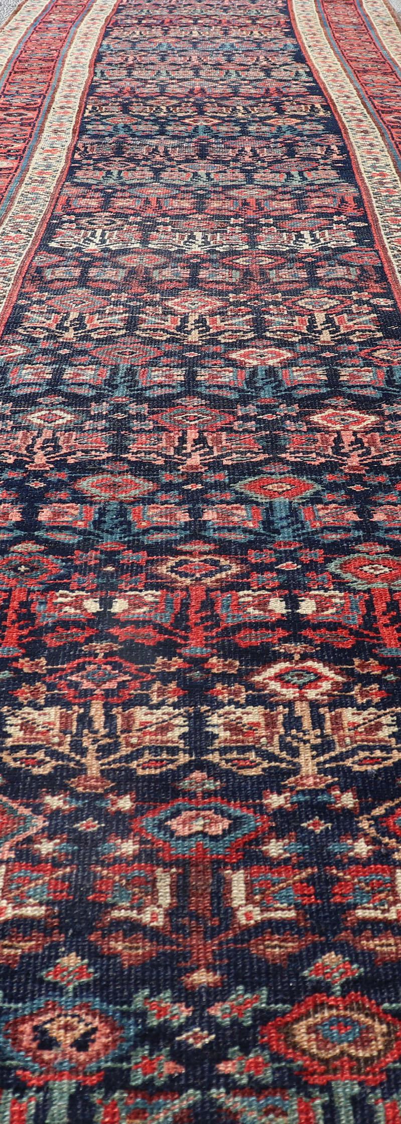 Tribal Antique Persian Bidjar Runner with Sub-Geometric Motifs in Red and Blue For Sale