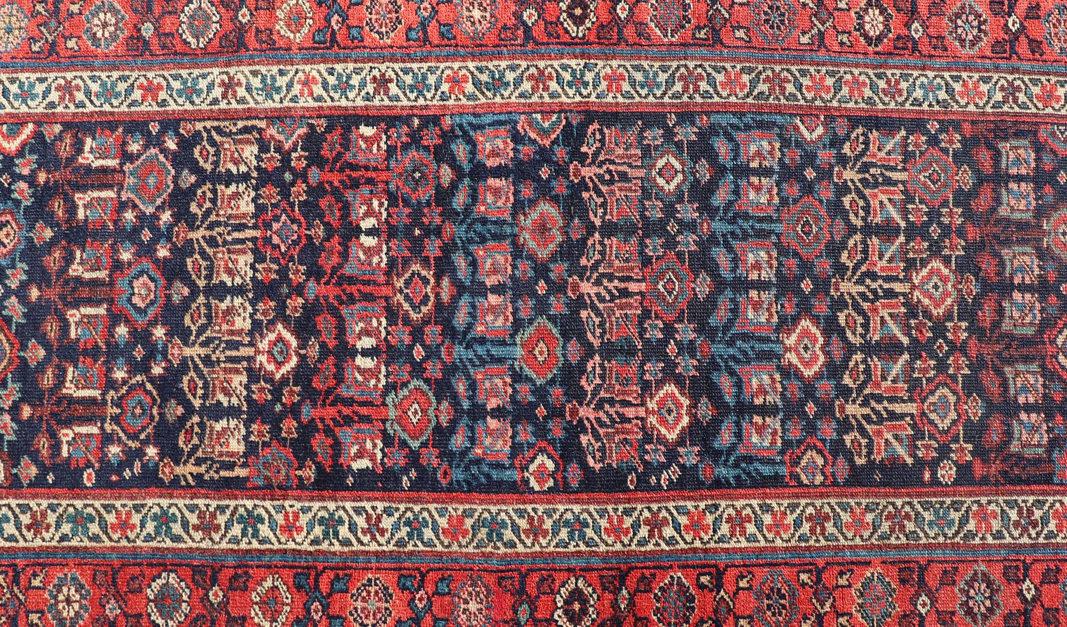 20th Century Antique Persian Bidjar Runner with Sub-Geometric Motifs in Red and Blue For Sale