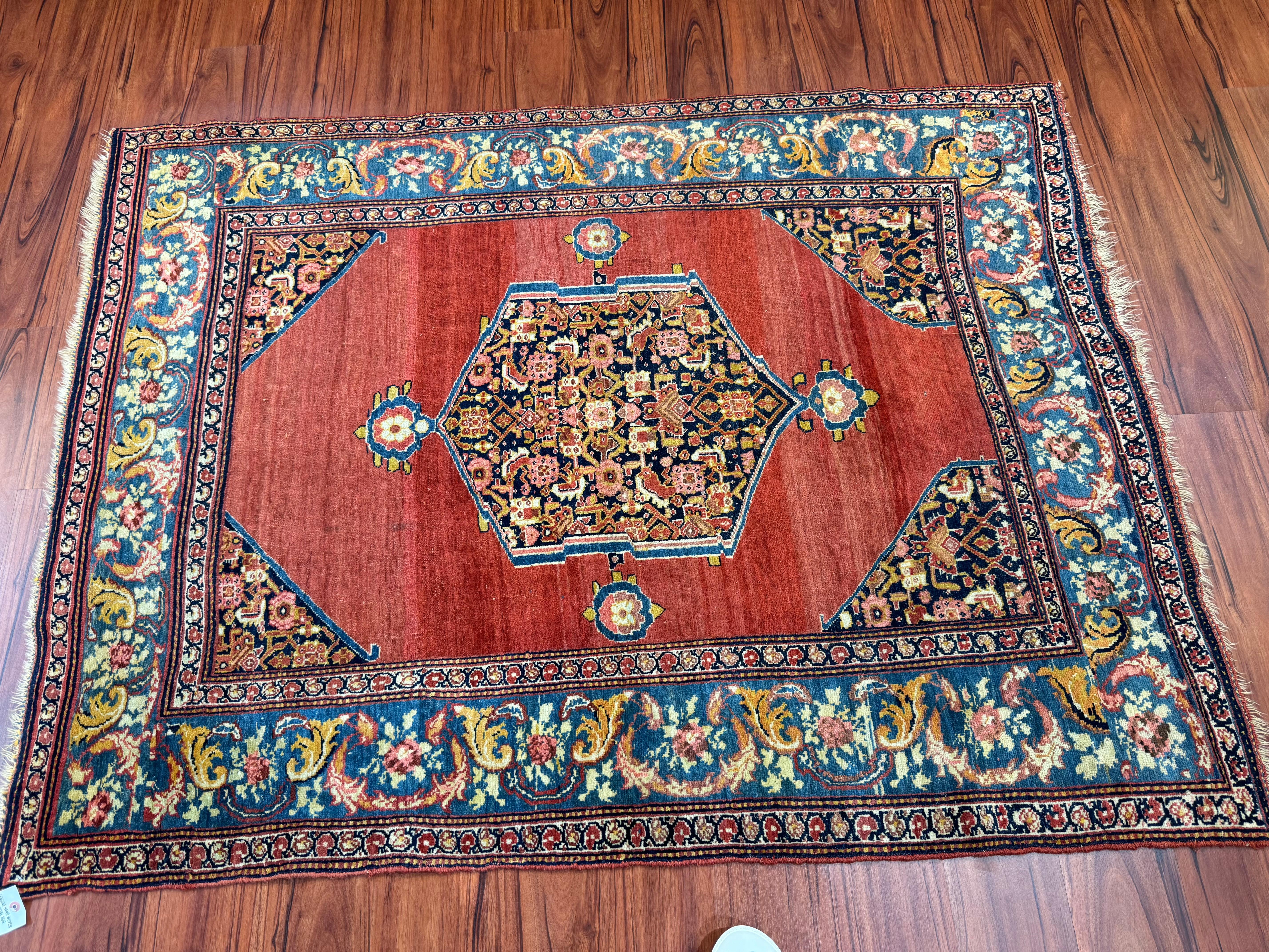 A stunning antique Persian Bijar Rug that originates from Iran in the late 19th century. This rug is in excellent condition considering its rich history and has beautiful red colors all over. Feel free to message me in regards to this listing or any