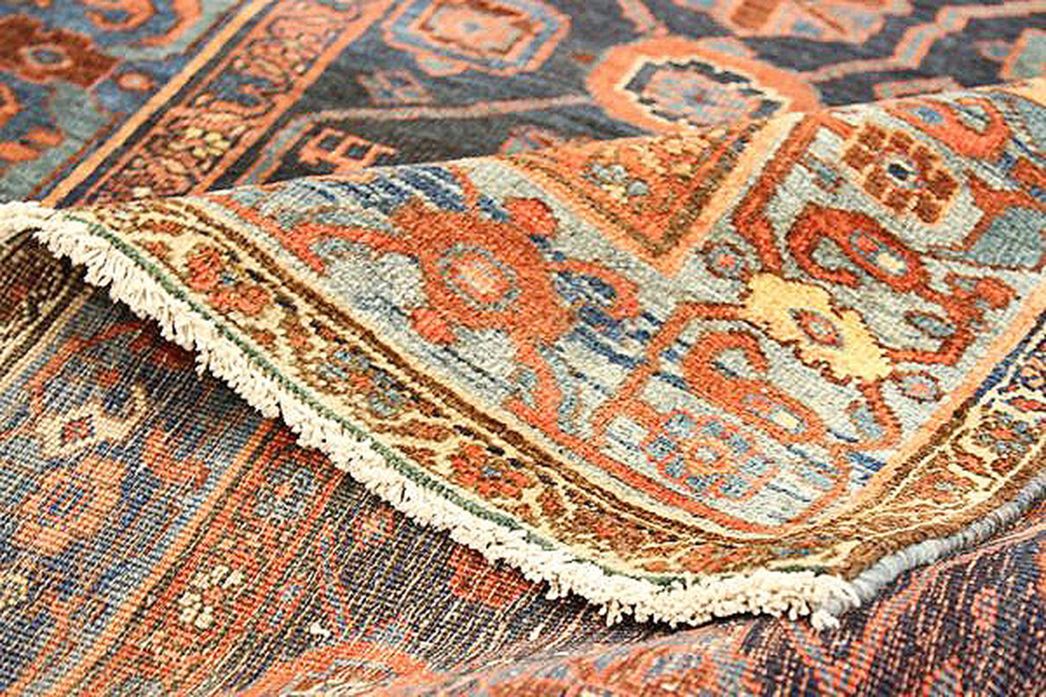 Other Antique Persian Bijar Rug with Blue and Red Floral Medallion on Black Field For Sale