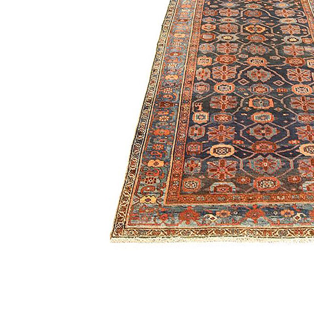 Hand-Woven Antique Persian Bijar Rug with Blue and Red Floral Medallion on Black Field For Sale